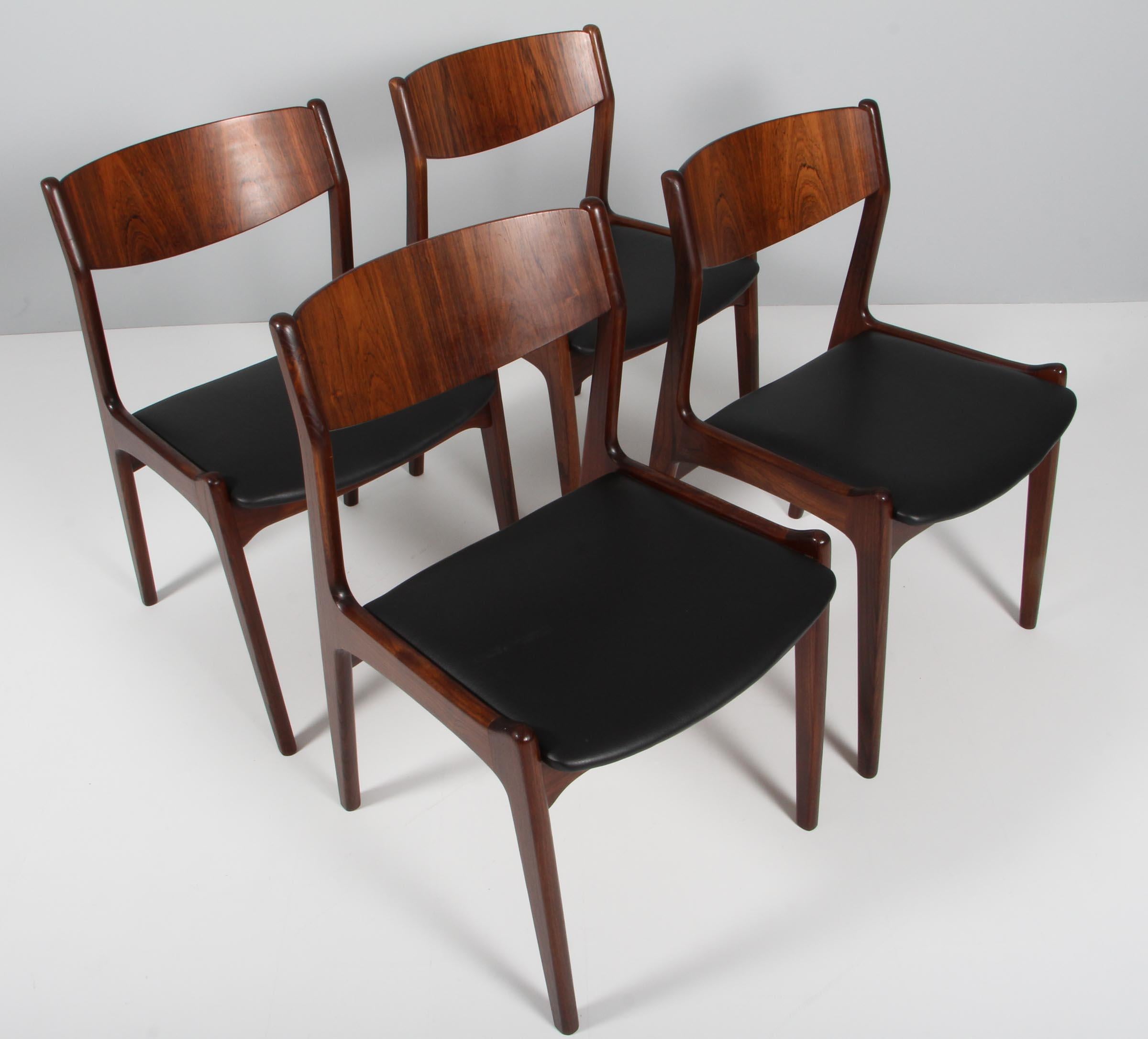 Vilhelm Jørgensen set of four dining chairs made of rosewood.

New upholstered with black aniline leather.

Made in the 1960s.