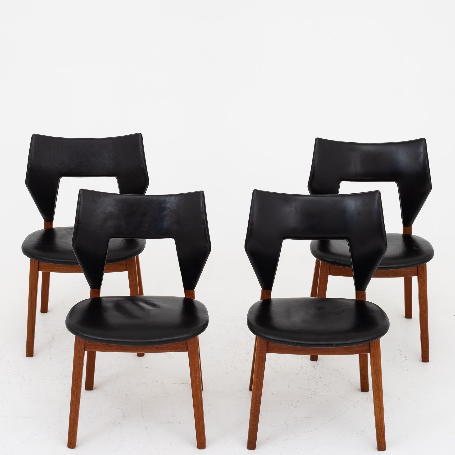 Set of 4 dining chairs with frame of teak and seat and back in black, patinated leather. Designed in 1960. Maker Thorald Madsen.