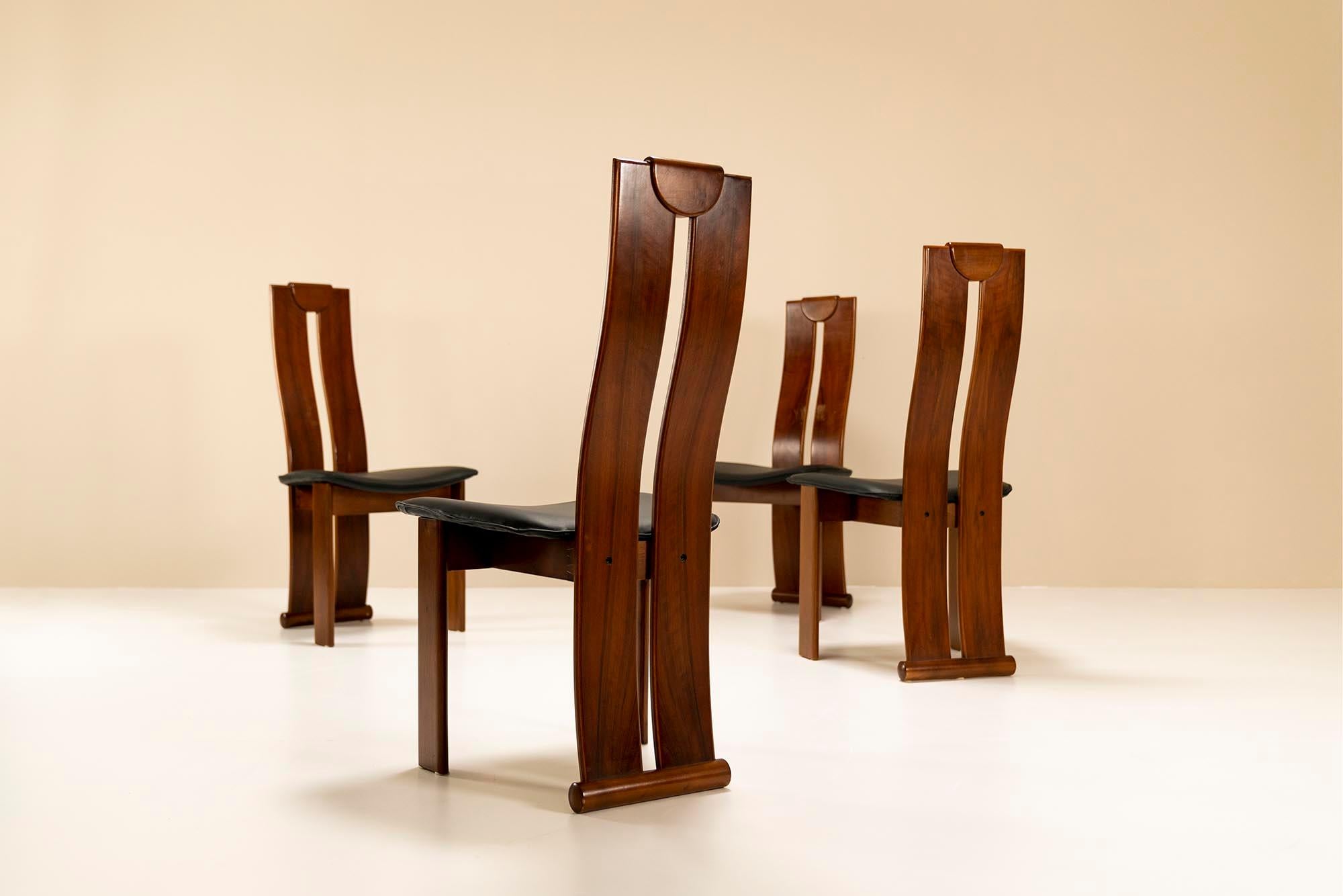 These dining chairs share great similarities with the designs of Afra and Tobia Scarpa and Mobil Girgi. This is a playful design that follows the rule of a dining chair. Meaning that its aesthetics have to mainly be jugded when seen from the back,
