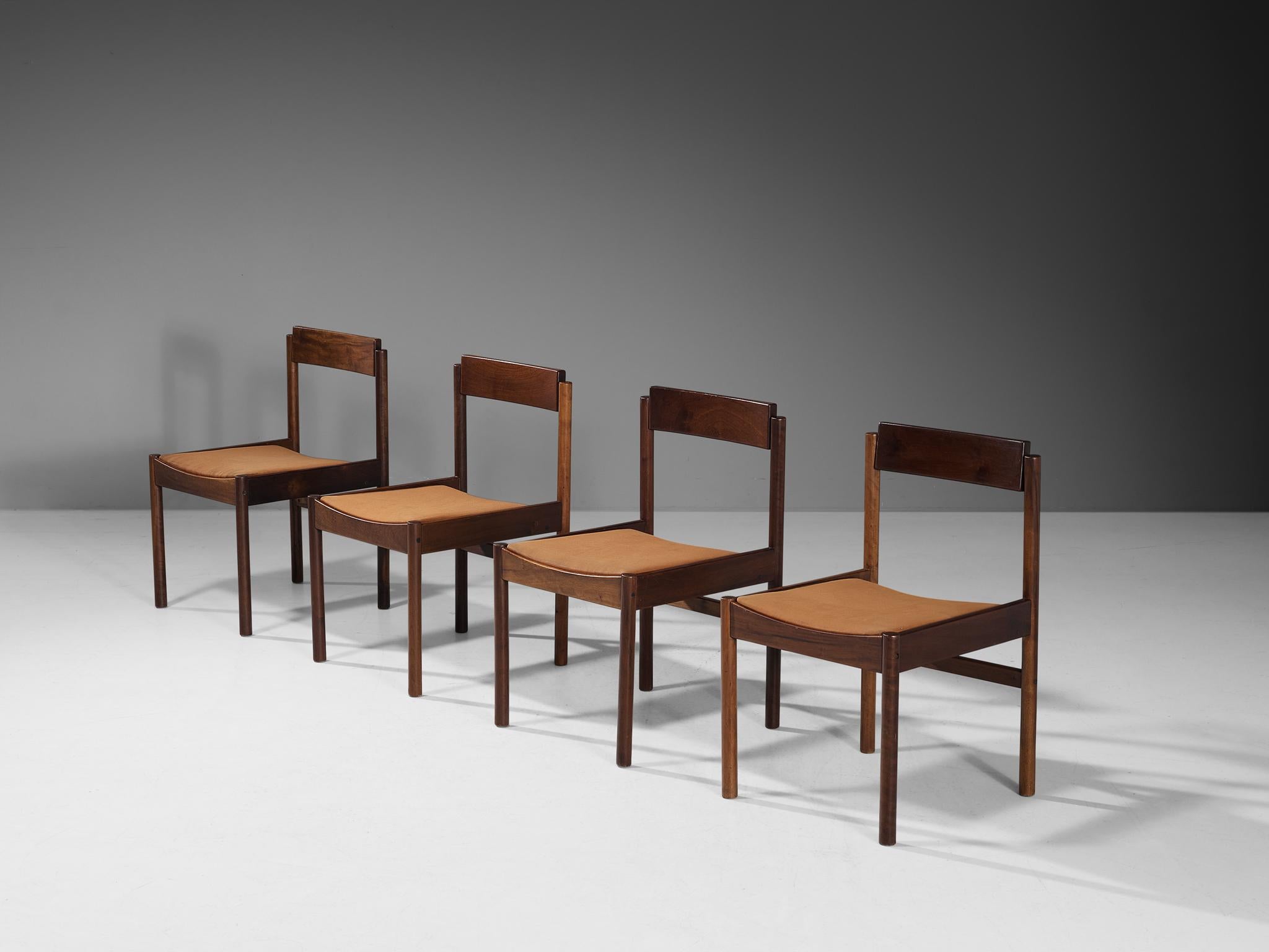 Set of four dining chairs, walnut, fabric, Europe, 1960s.

This design has a strong and sincere appearance constructed due to the subtle and minimalist wooden frame. The rotatable backrest proofs the great eye for detail and high-level of