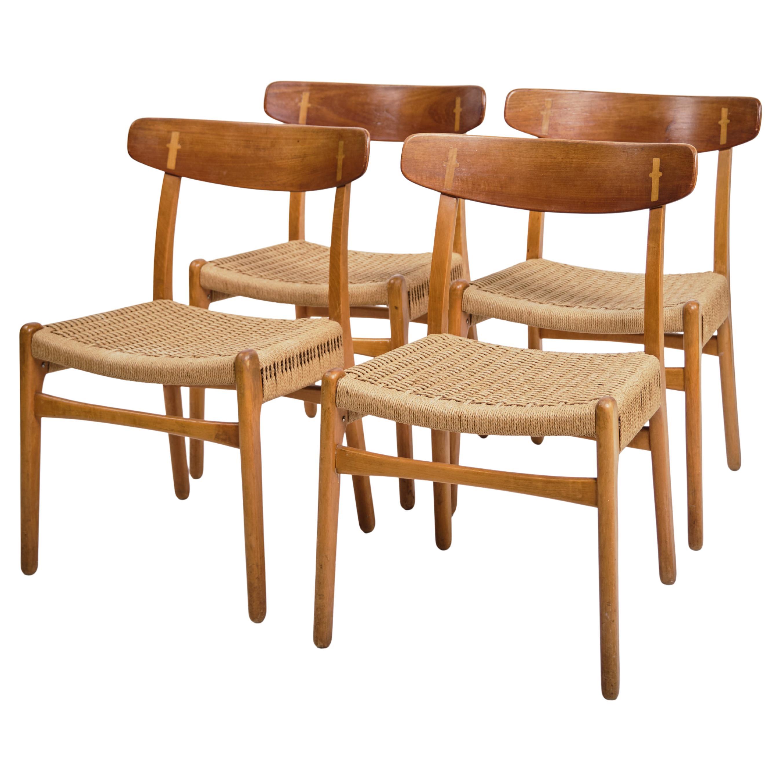 Ensemble de quatre chaises de salle à manger Model No. CH23 en teck par Hans J. Wegner des années 1960