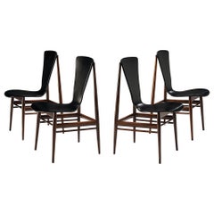 Set of Four Dining Chairs with Sculptural Back