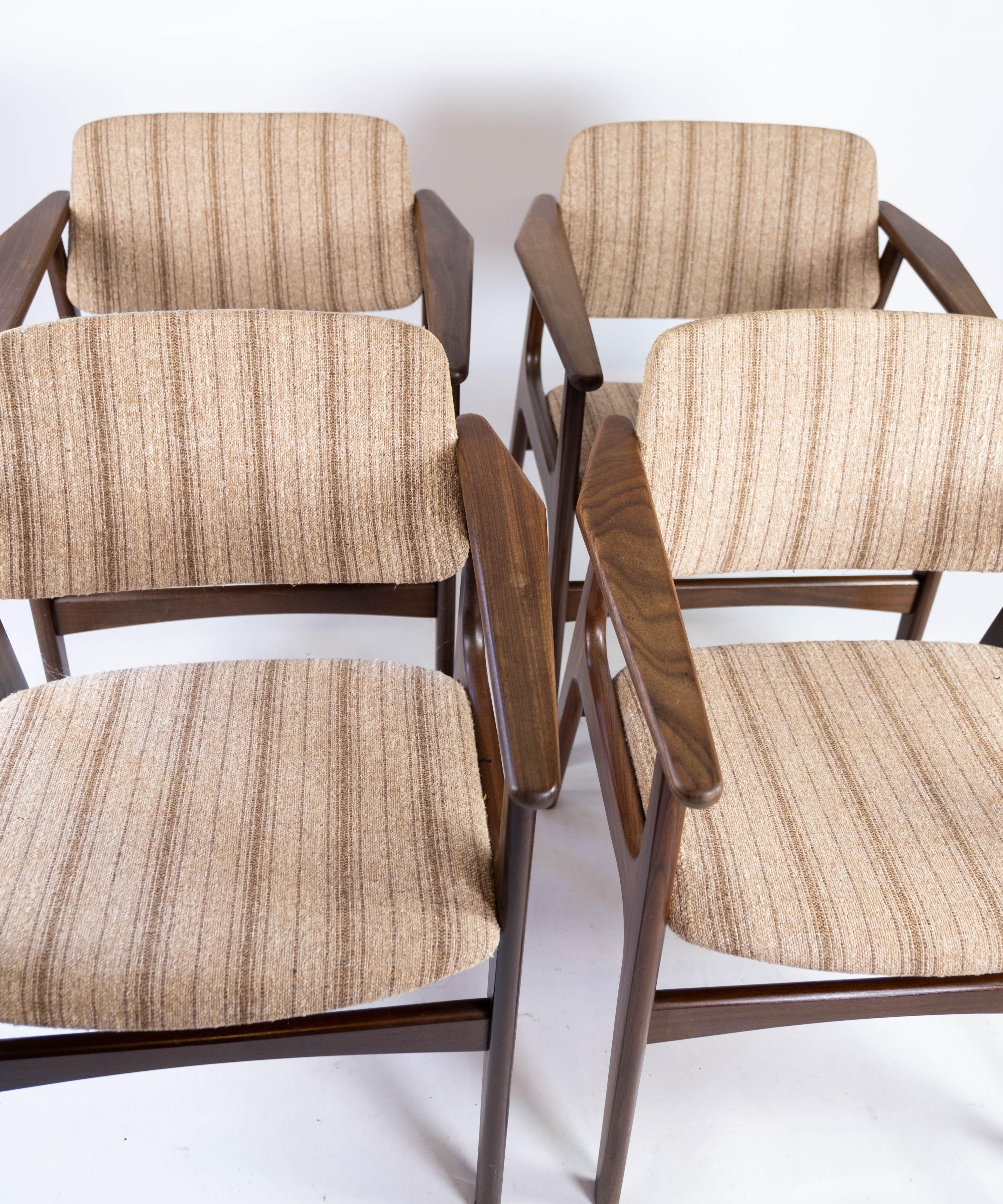 This set of four teak dining chairs, known as model 