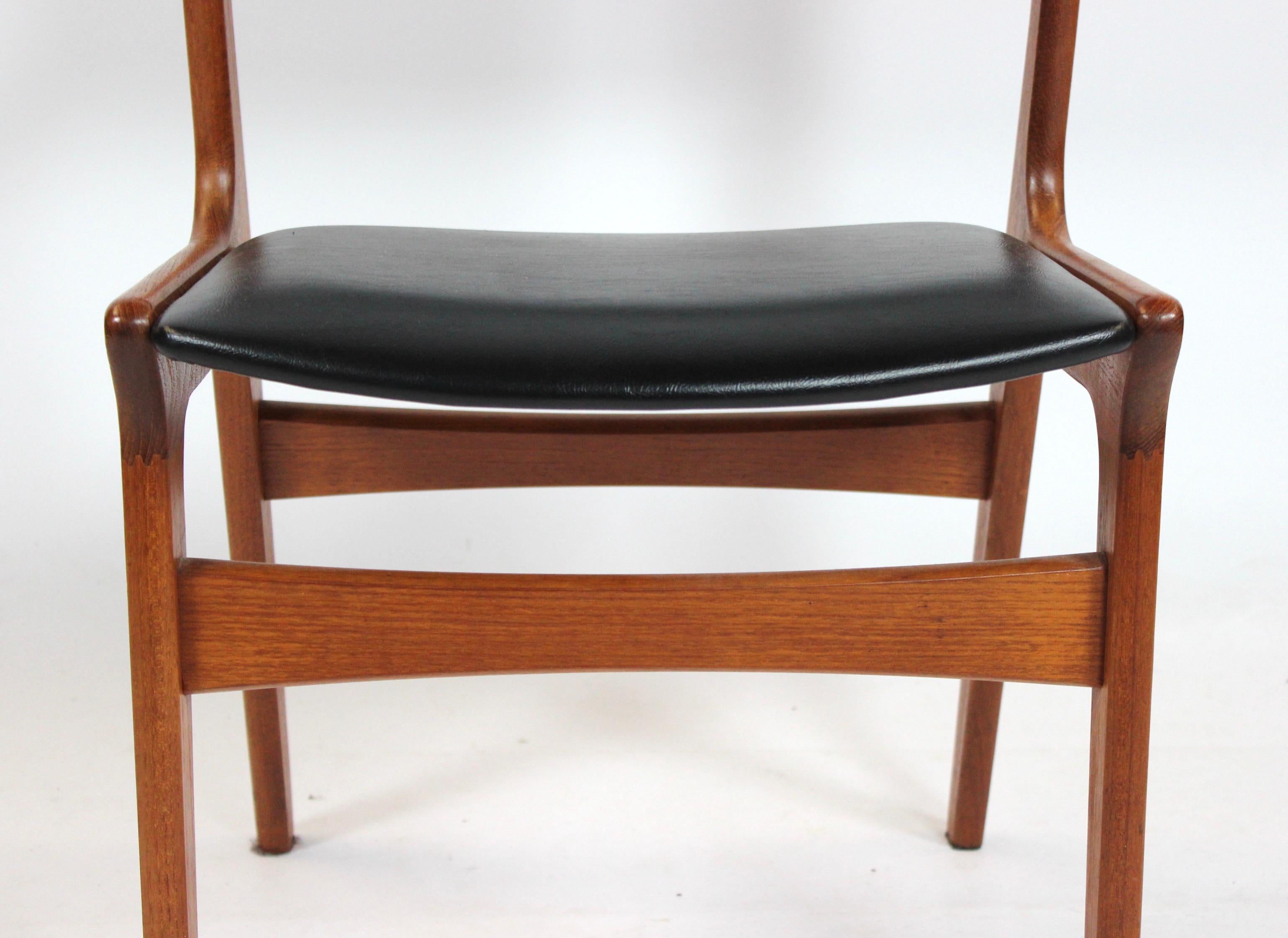 Set of four dining room chairs in rosewood and upholstered with black leather of Danish design and manufactured by Nova Furniture Factory in the 1960s. The chairs are in great vintage condition.
 