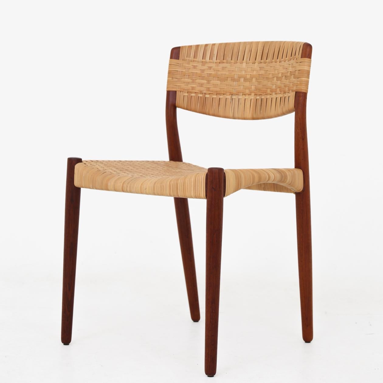 Set of four dining chairs in teak with patinated cane, 1950s. Ejner Larsen & Aksel Bender Madsen / Willy Beck.