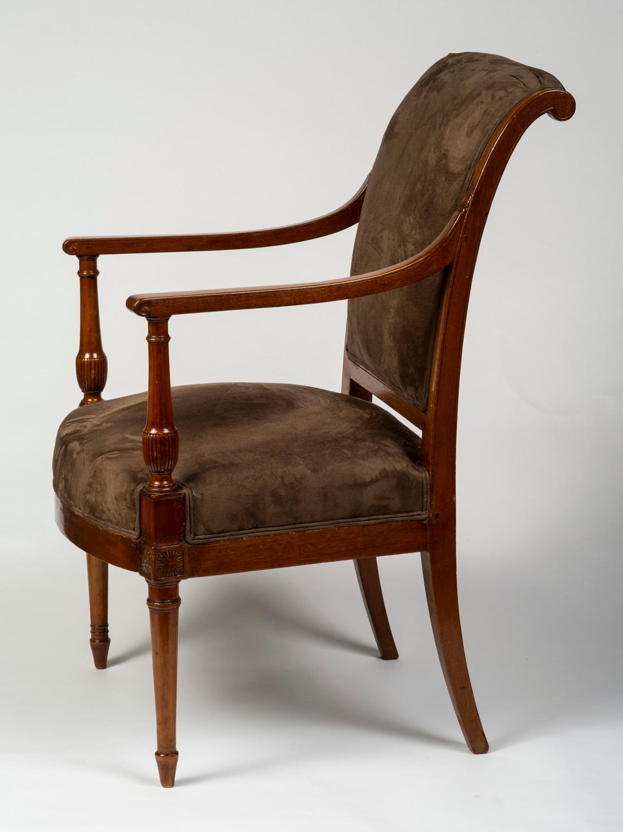 Each upholstered backrest with backscrolled top rail above an upholstered seat flanked by arm rests, raised on ring-turned legs; each stamped JACOB FRERES / RUE MESLEE on back rail, three with old inked inscription M Julien to label on the back