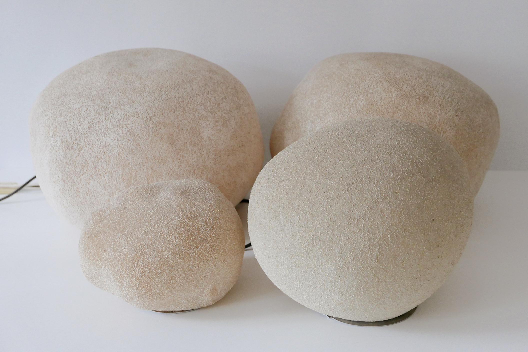 Set of four Mid-Century Modern 'Dorra' rock or stone shaped floor or table lamps in four different sizes. Designed by André Cazenave. The two large ones manufactured by Atelier A, France and the other two smaller ones by Tecta, Germany,