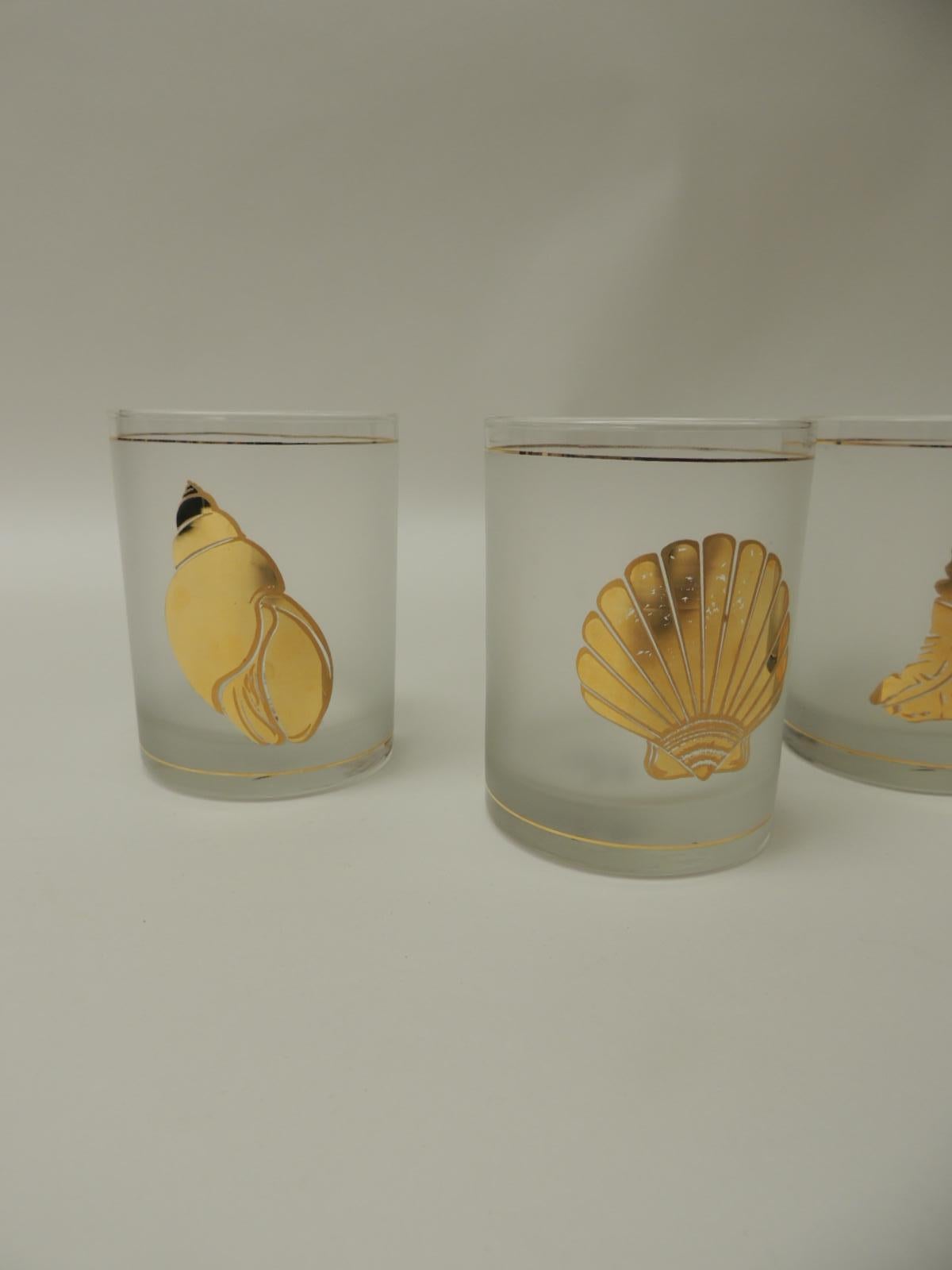 Set of four double old-fashioned frosted glass drinking glasses
Gold accent coastal living glasses depicting sea shells.
Size: 3 D x 4 H.