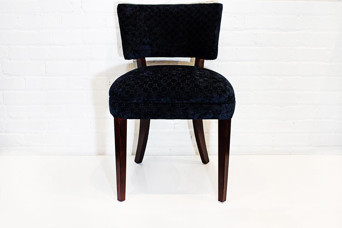 Set of four vintage dining chairs refinished in dark blue chenille with a geometric pattern. Dark walnut stain on wood. Spring seats are super comfy.

Dimensions: 20
