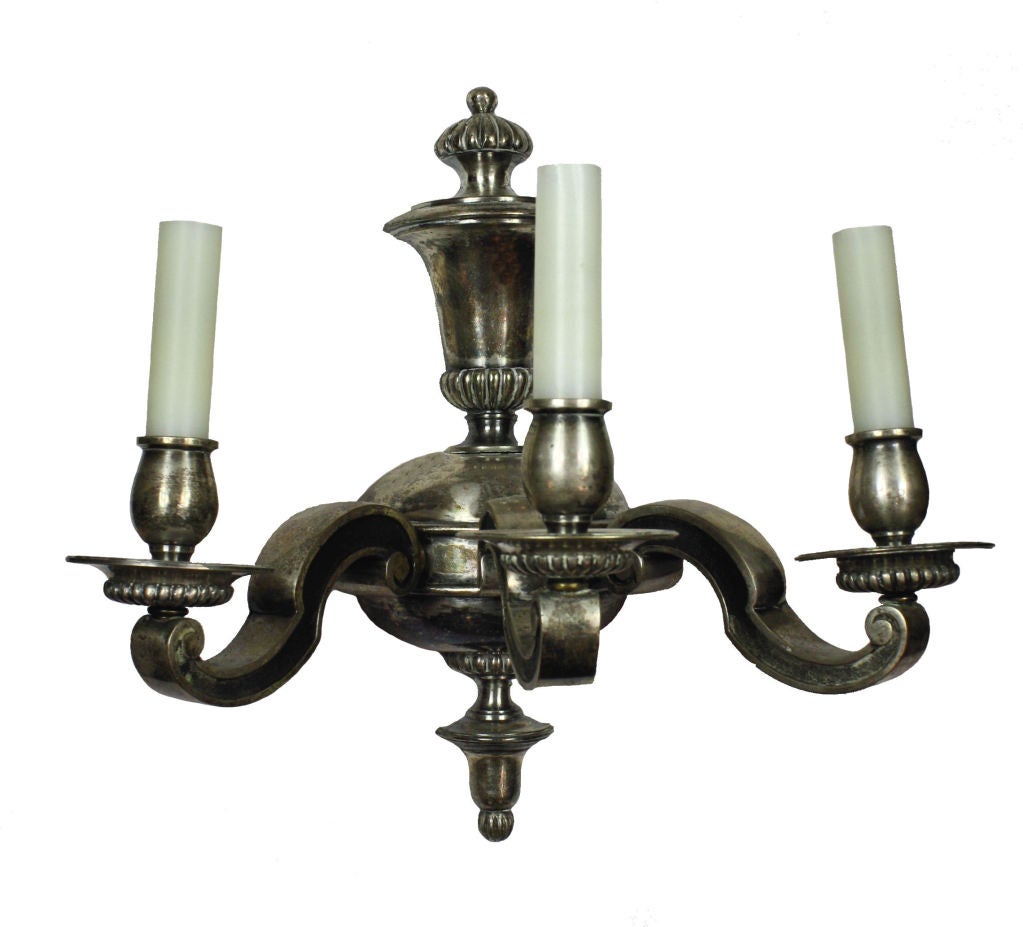 A set of four Dutch silver plated bronze, triple branch wall lights.