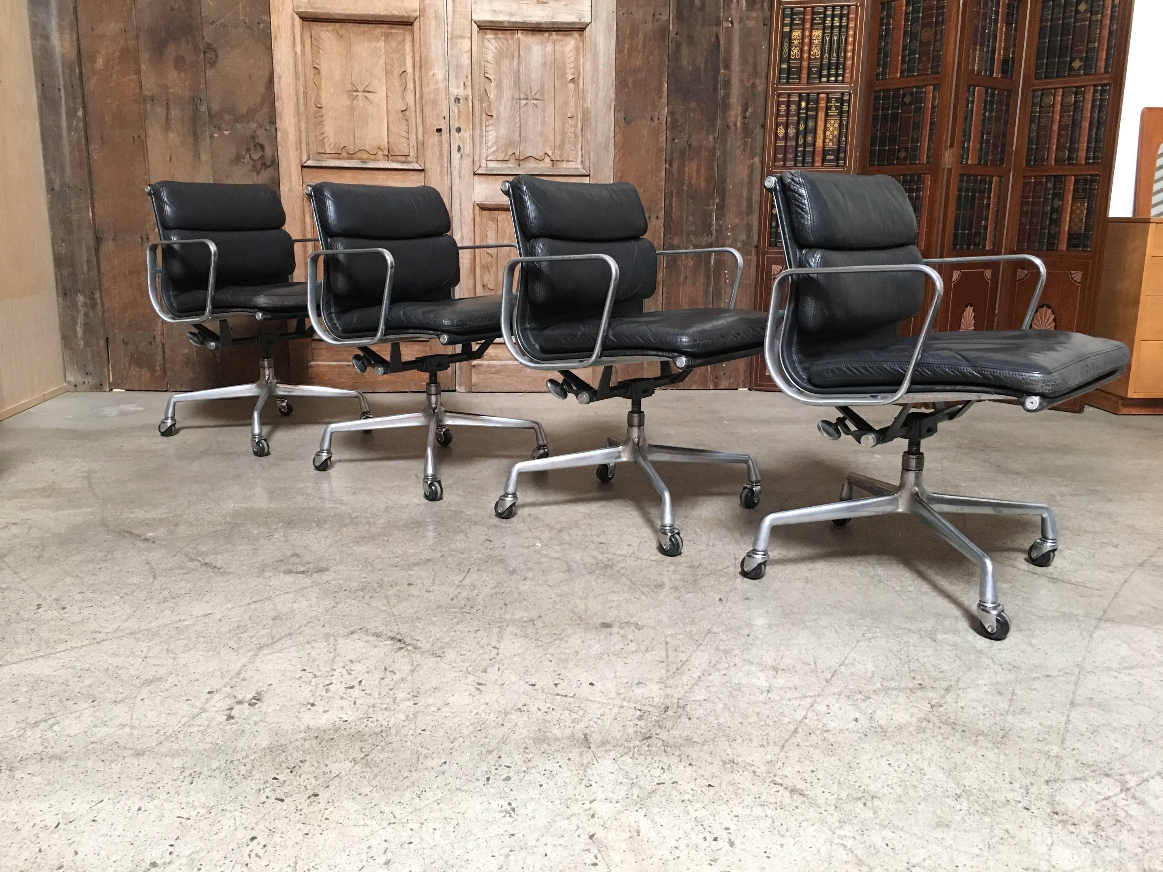 We have four of these soft pad aluminium group management desk chairs available designed by Charles and Ray Eames for Herman Miller. Featuring the original vintage black leather upholstery over four-star aluminium base and frame.