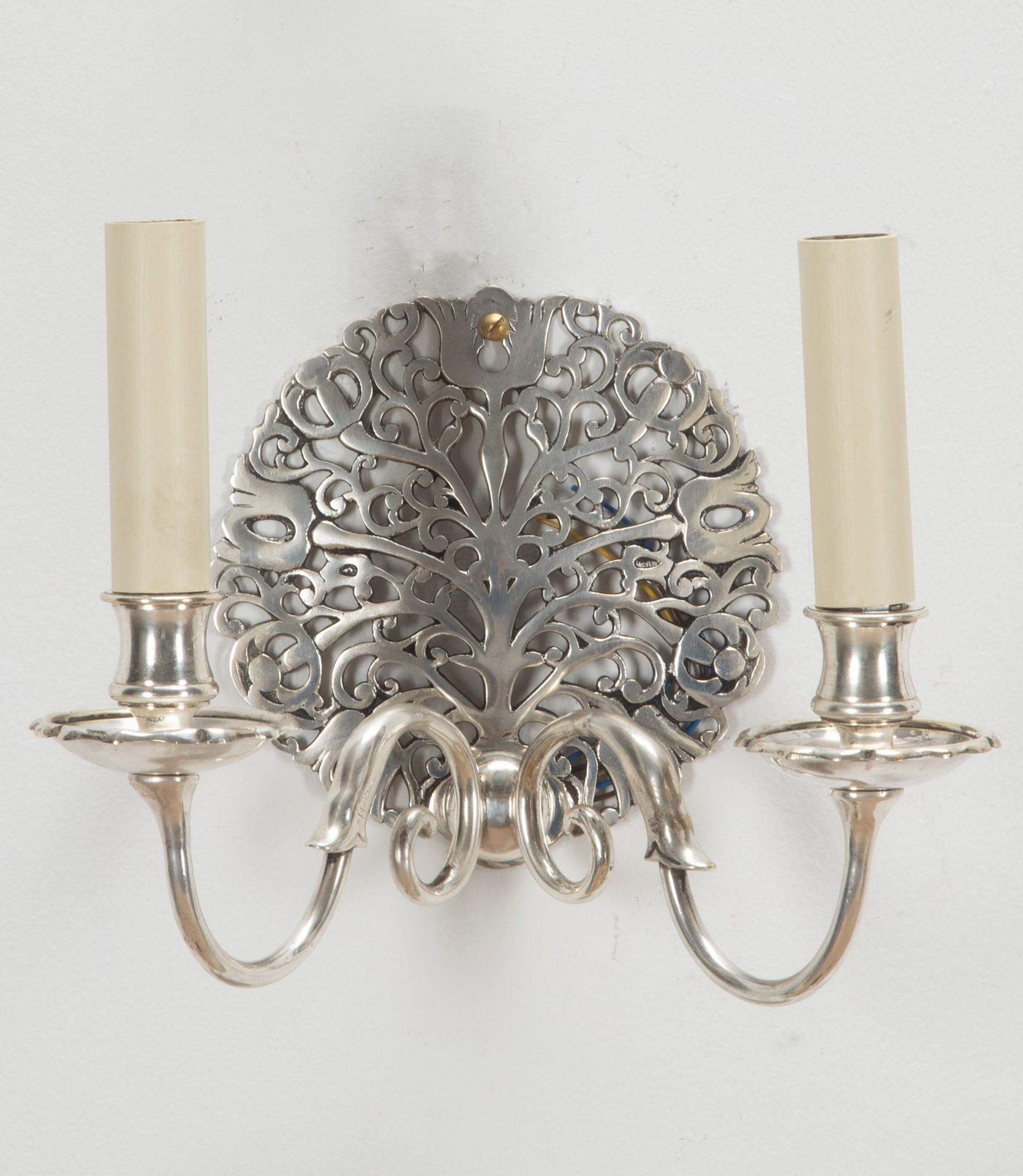 Set of six English Arts and Crafts wall lights, in the manner of Ernest Gimson, of the Cotswold school. 
Original unlacqucquered silver plate on cast brass. Fully rewired and tested to UK standards. 