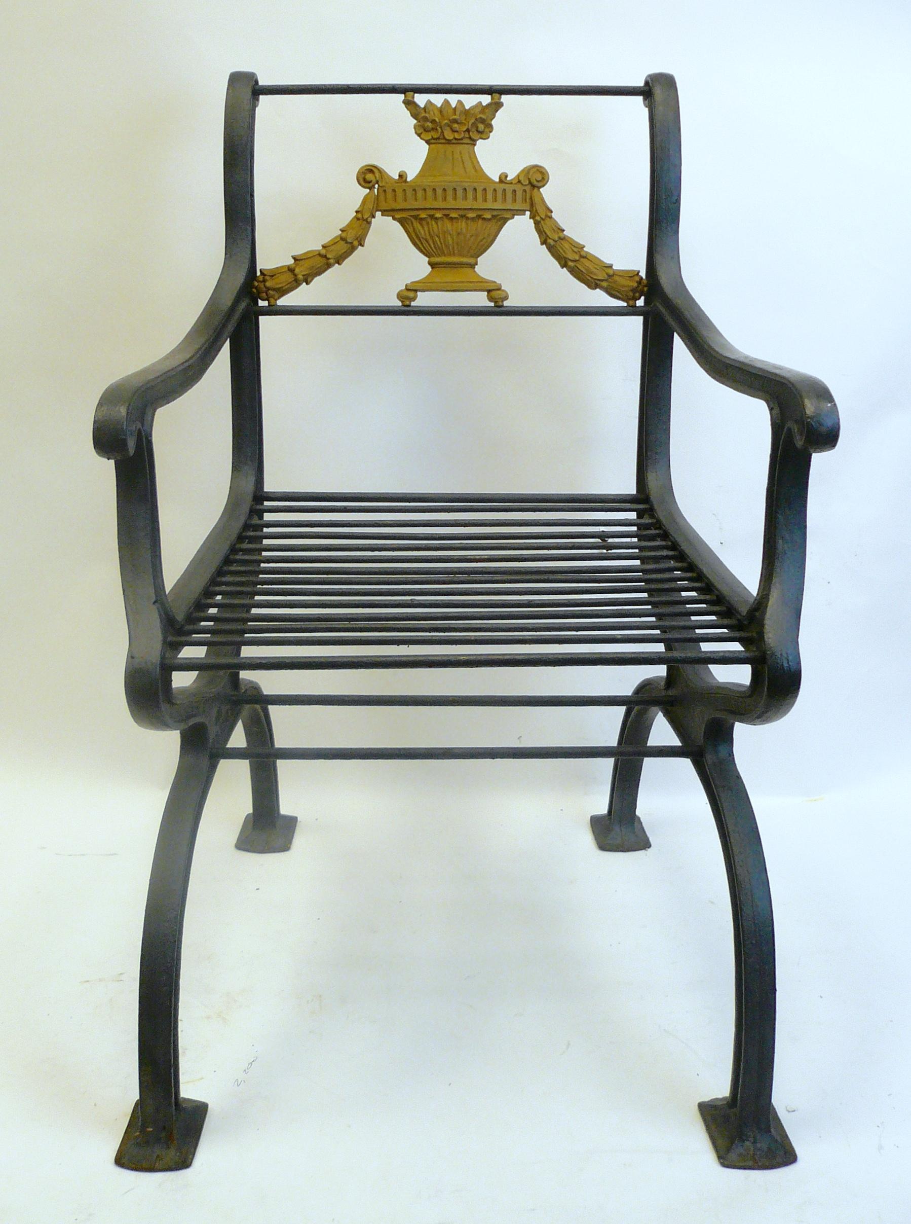 These quality iron garden chairs are signed W. A. Snow, Boston. The backs feature lidded urns and swags.