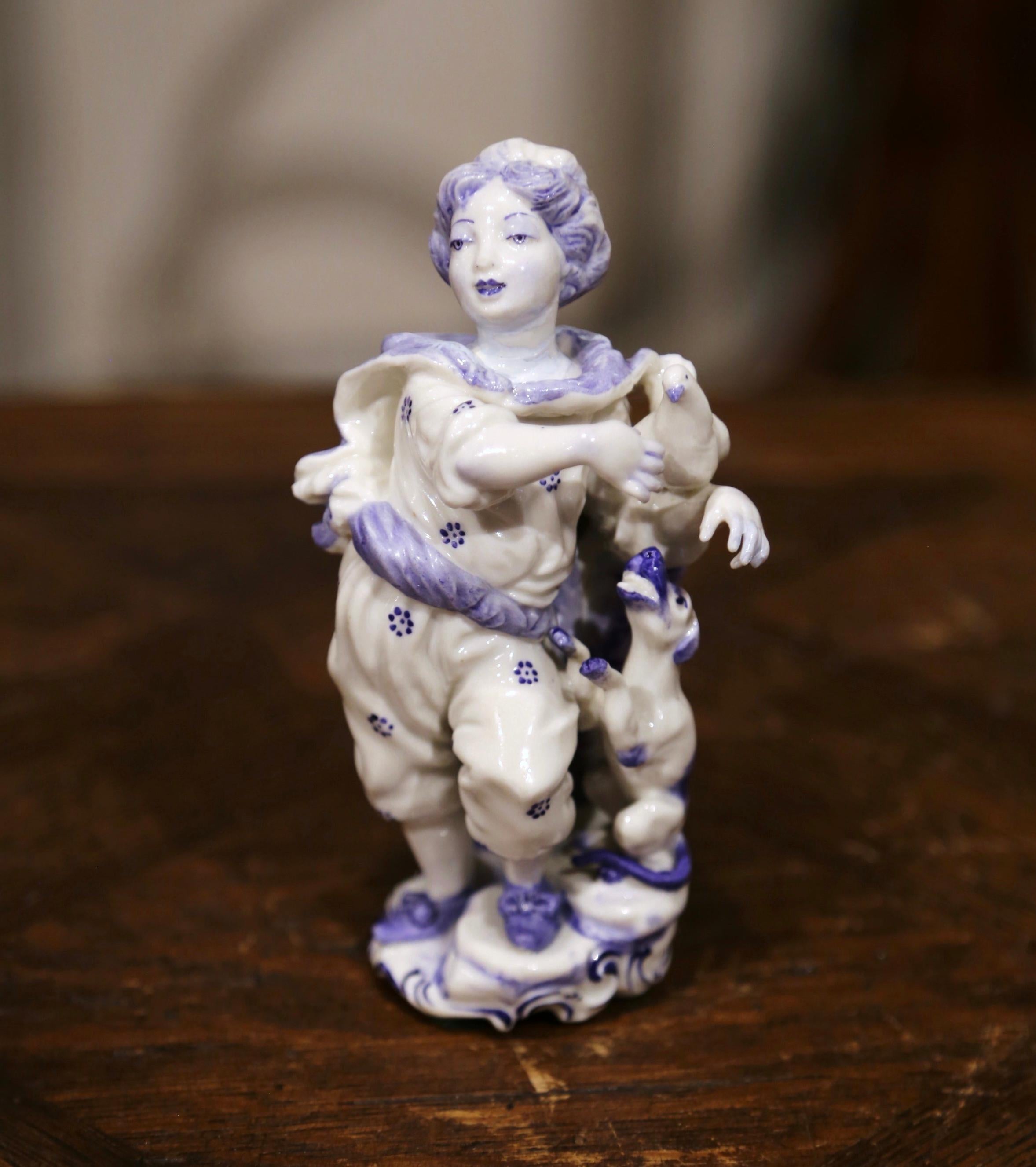 Hand-Painted Set of Four Early 20th Century Dutch Hand Painted Porcelain Delft Figurines For Sale