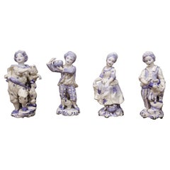 Set of Four Early 20th Century Dutch Hand Painted Porcelain Delft Figurines