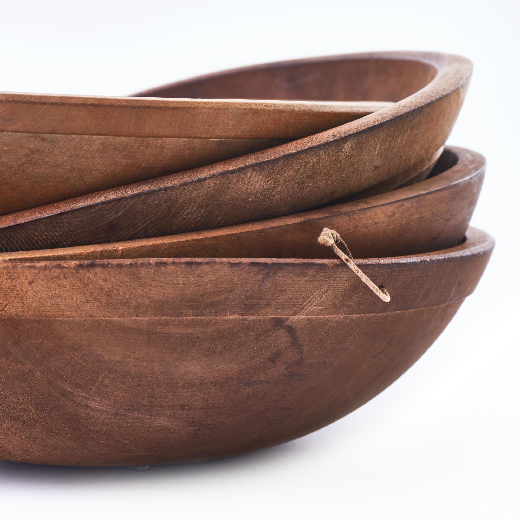 Set of four early 20th century dough bowls from England. Graduated sizes, with some wear consistent with usage. Beautiful naturally aged patina. 

Measures: 4” H x 12”-15.5” D.
