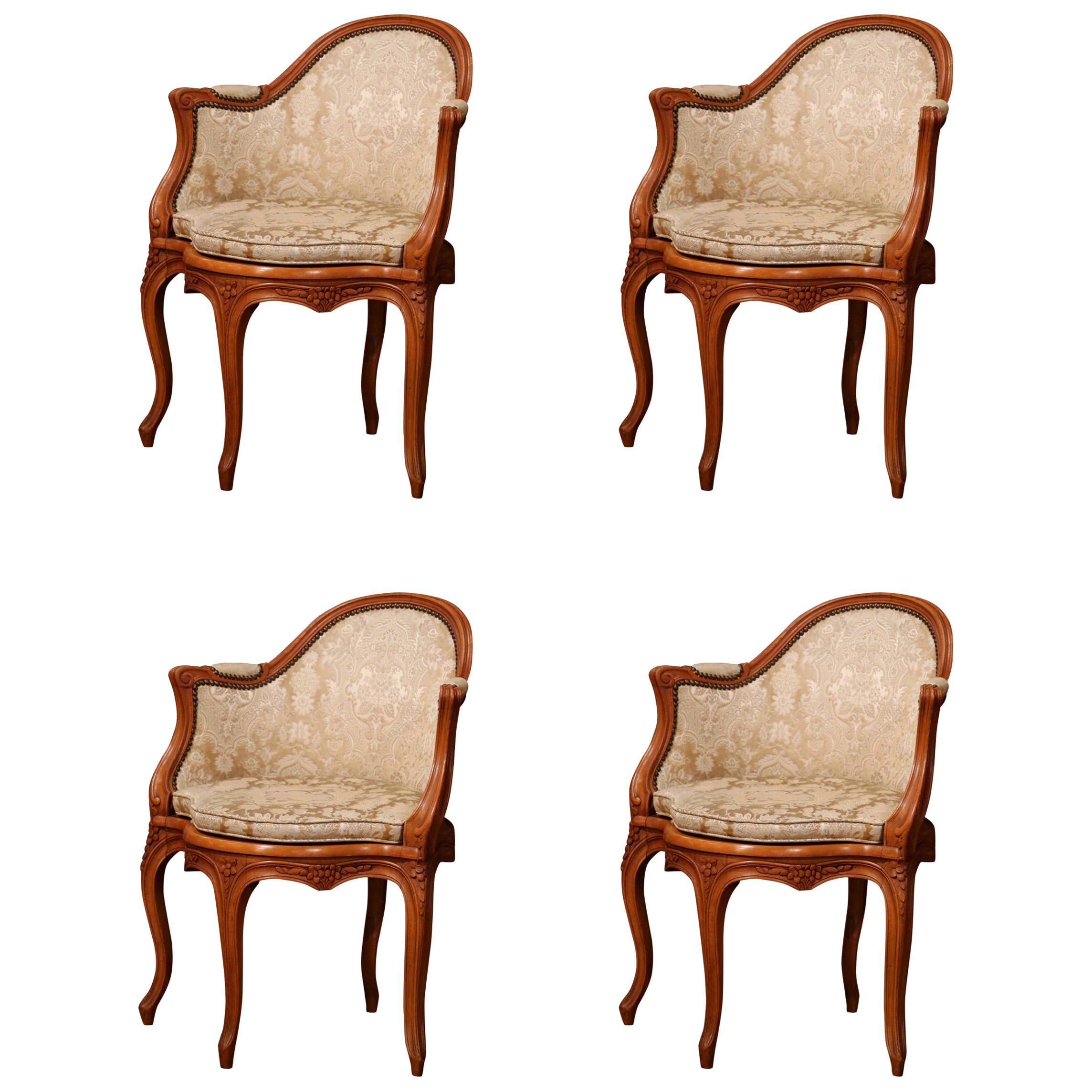 Set of Four Early 20th Century French Louis XV Carved Walnut Armchairs