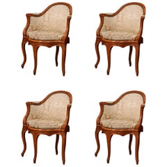 Set of Four Early 20th Century French Louis XV Carved Walnut Armchairs Set of Four Early 20th Century French Louis XV Carved Walnut Armchairs