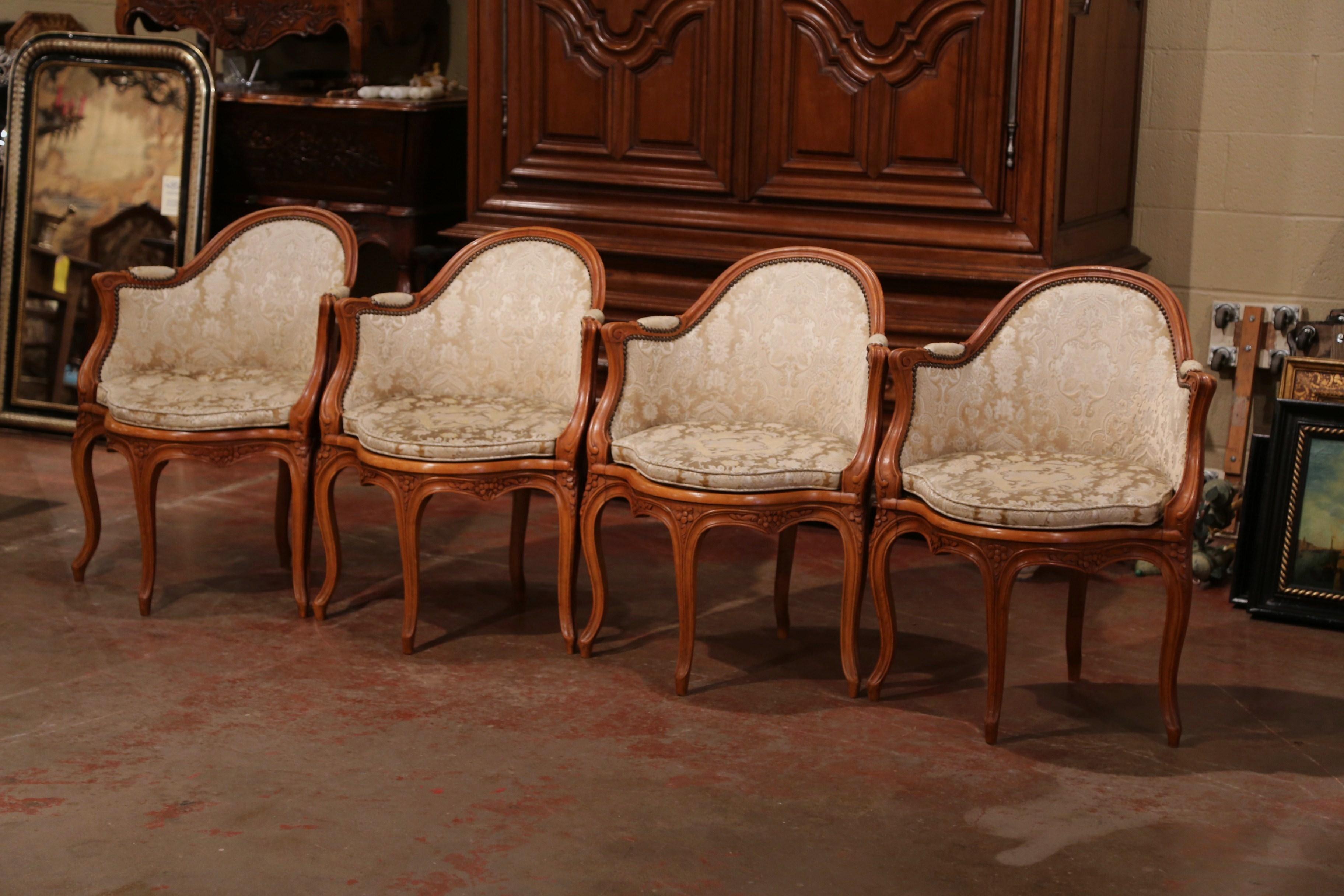 Place these four, Louis XV antique chairs around a game table for comfort and style. Crafted in Lyon, France, circa 1920, each unique armchair features an arched and rounded back, padded armrests on both sides, and four cabriole legs over a