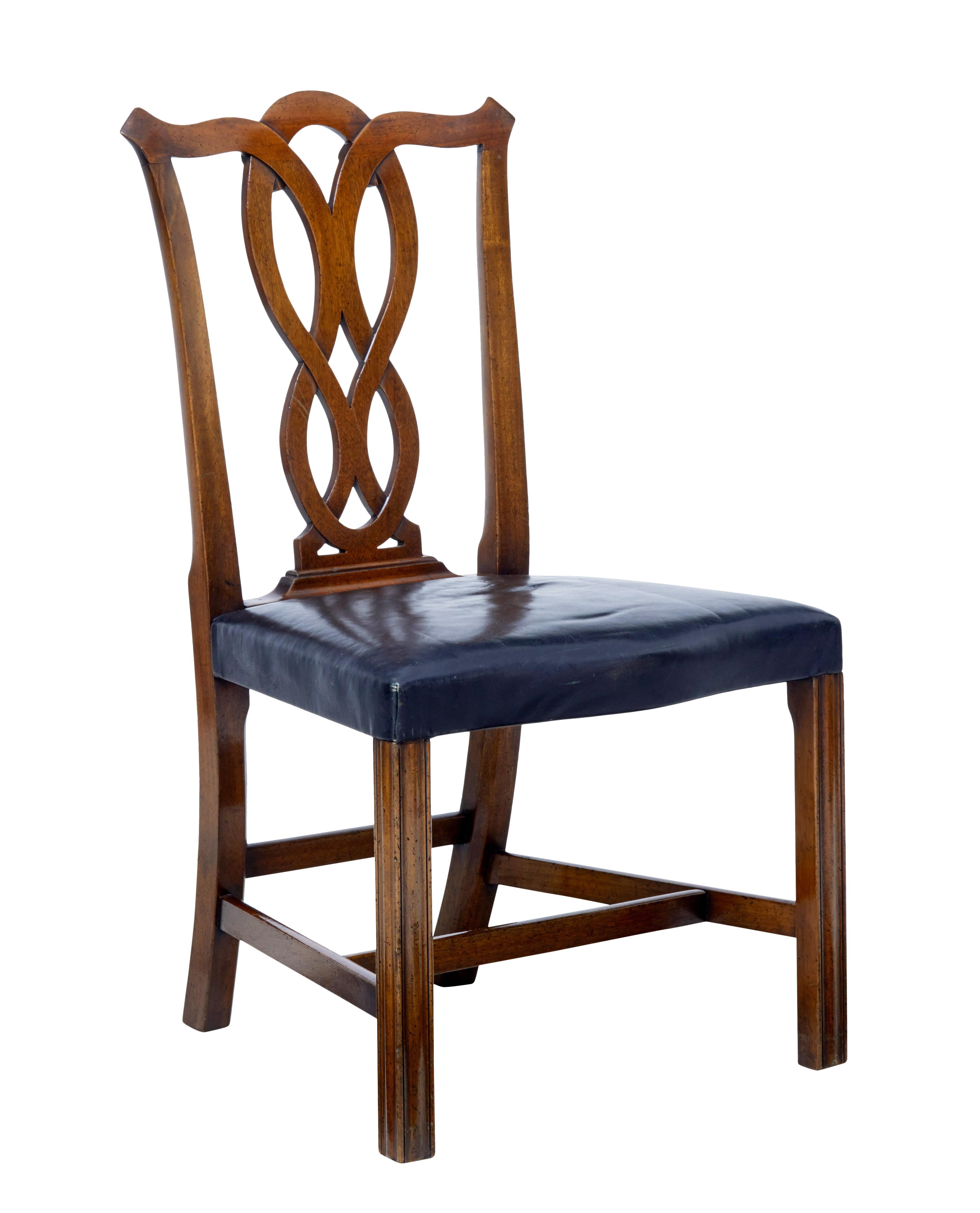 Fine small set of four dining chairs by well known Swedish retailers Nordiska Kompaniet, circa 1930.

Beautiful Chippendale influenced walnut chairs, with scrolling latice backs. Black leather seats, standing on straight legs united by