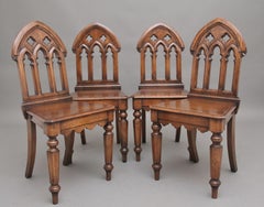 Set of four early 20th Century Gothic style hall chairs