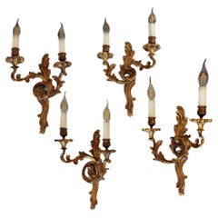Conjunto de cuatro apliques de latón estilo rococó de principios del siglo XX