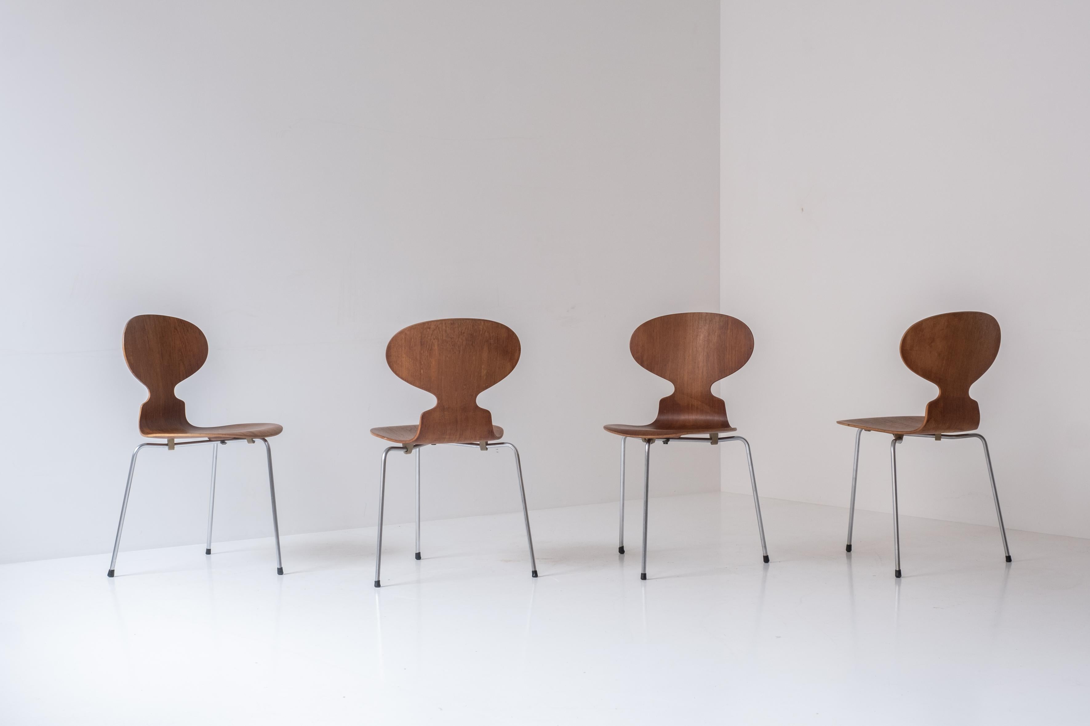 Set of four early ‘Ant’ chairs designed by Arne Jacobsen for Fritz Hansen, Denmark 1951. This is Model No. 3100 and features teak seats and a tubular steel frames. Presented in a very good condition. Labeled underneath
