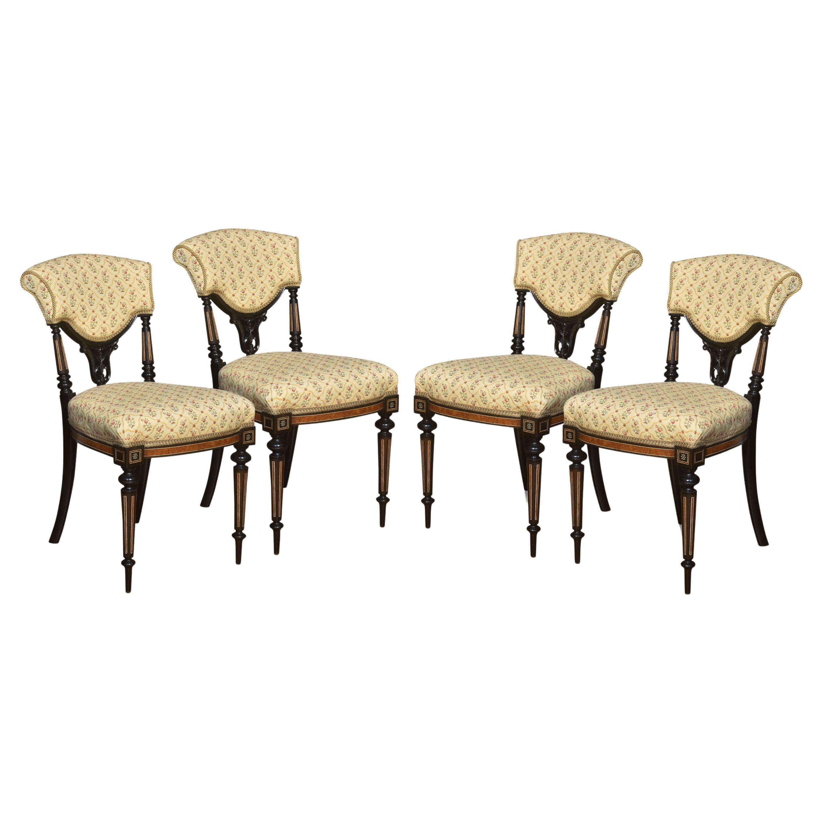 Set of four ebony and amboyna side chairs