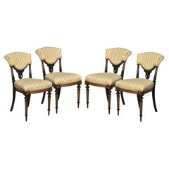 Set of four ebony and amboyna side chairs