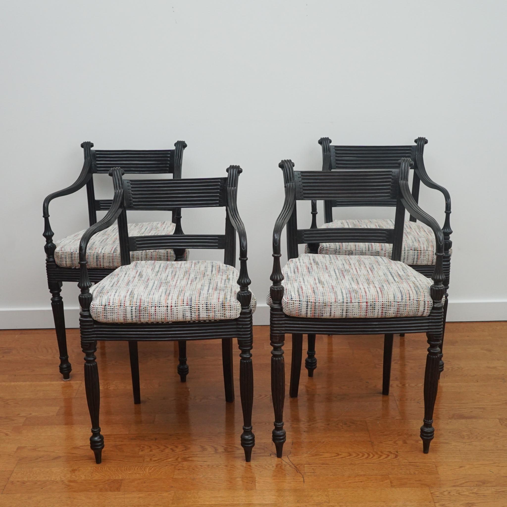 Indian Set of Four Ebony Carved Cane Seat Dining Armchairs For Sale
