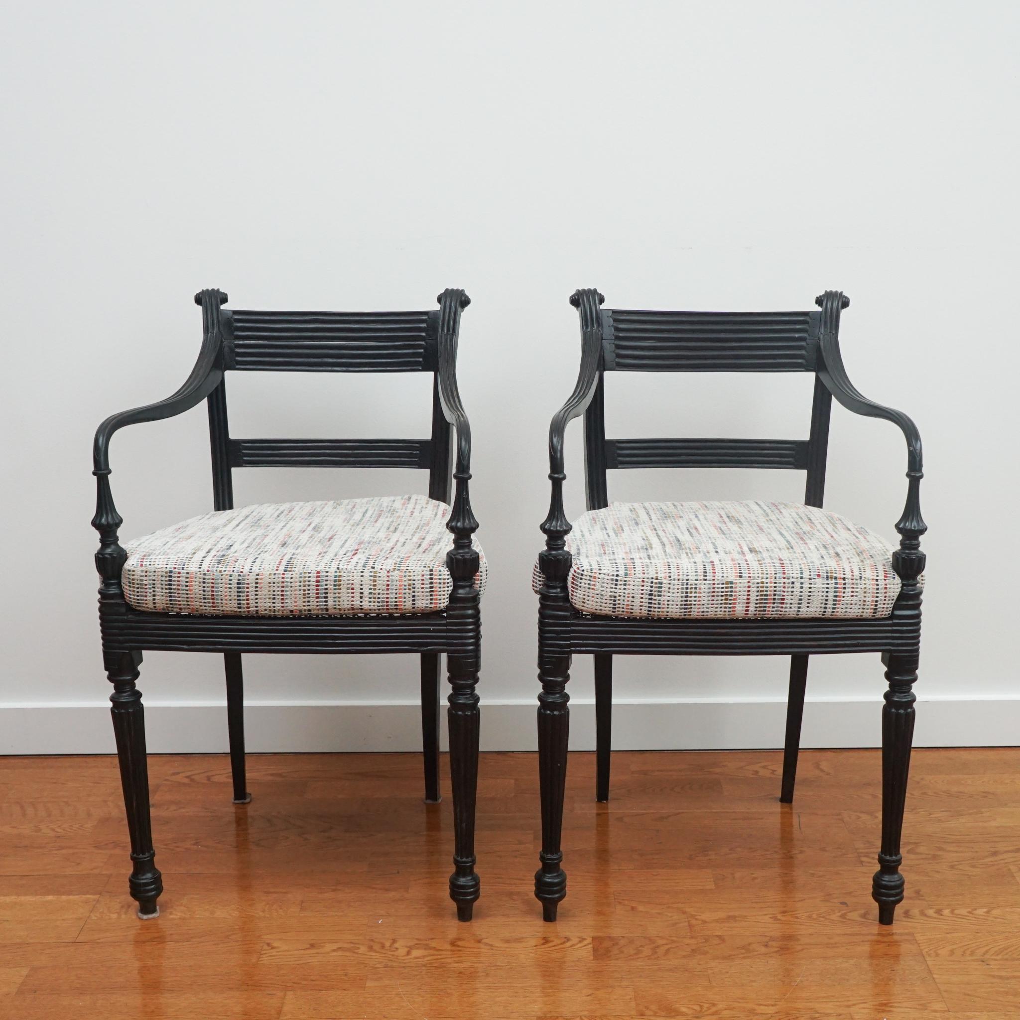 Machine-Made Set of Four Ebony Carved Cane Seat Dining Armchairs For Sale
