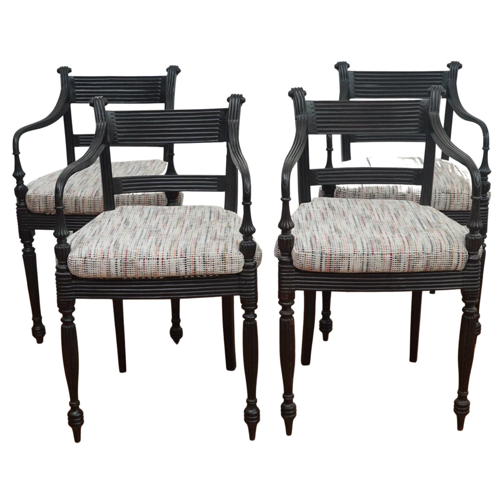 Set of Four Ebony Carved Cane Seat Dining Armchairs For Sale