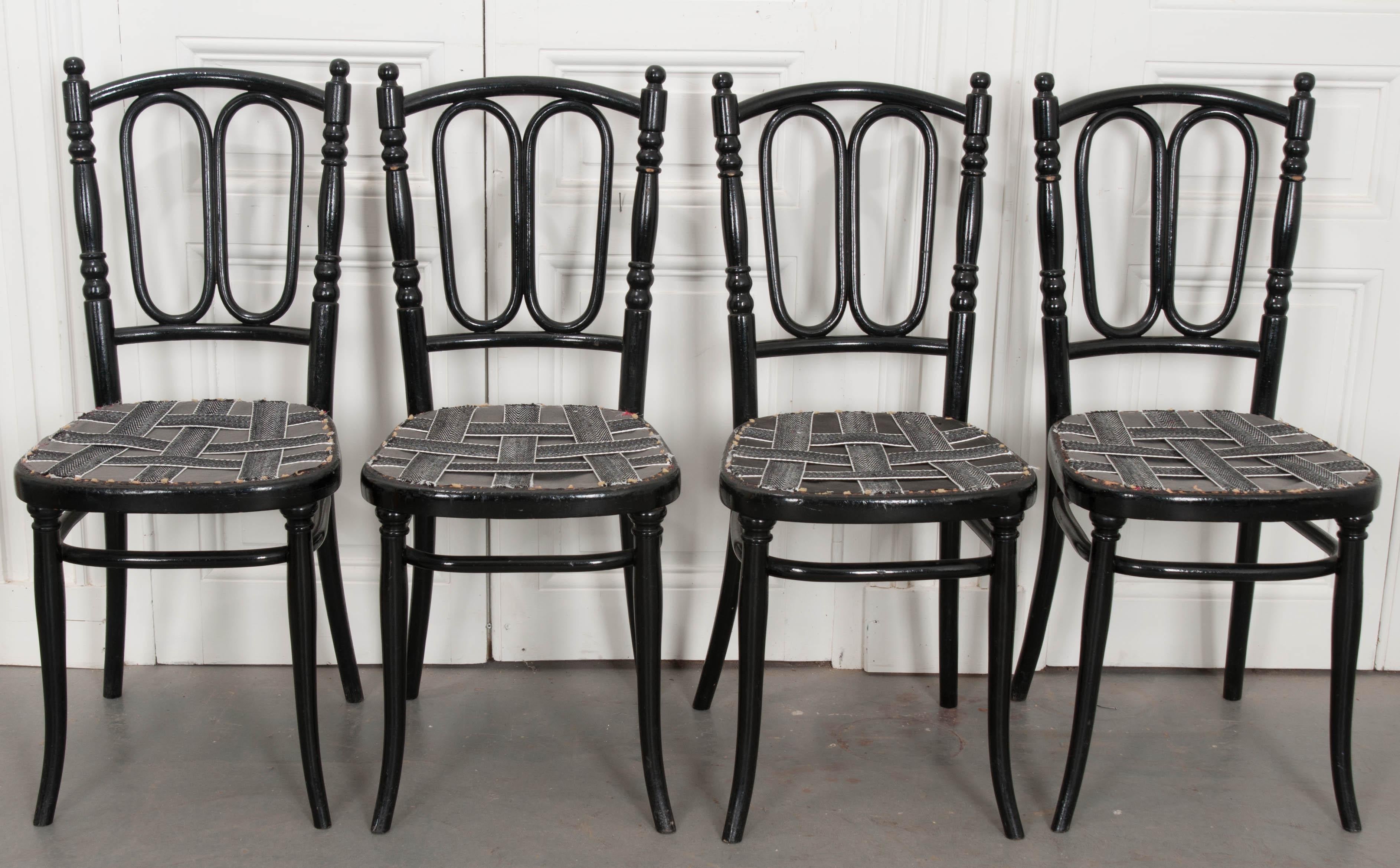 A superb set of four ebonized bentwood side chairs, c. 1900, by Michael Thonet. Thonet is credited for creating the iconic bentwood chair. He was a German-Austrian cabinet/furniture maker and to this day, his progeny still runs the business. This