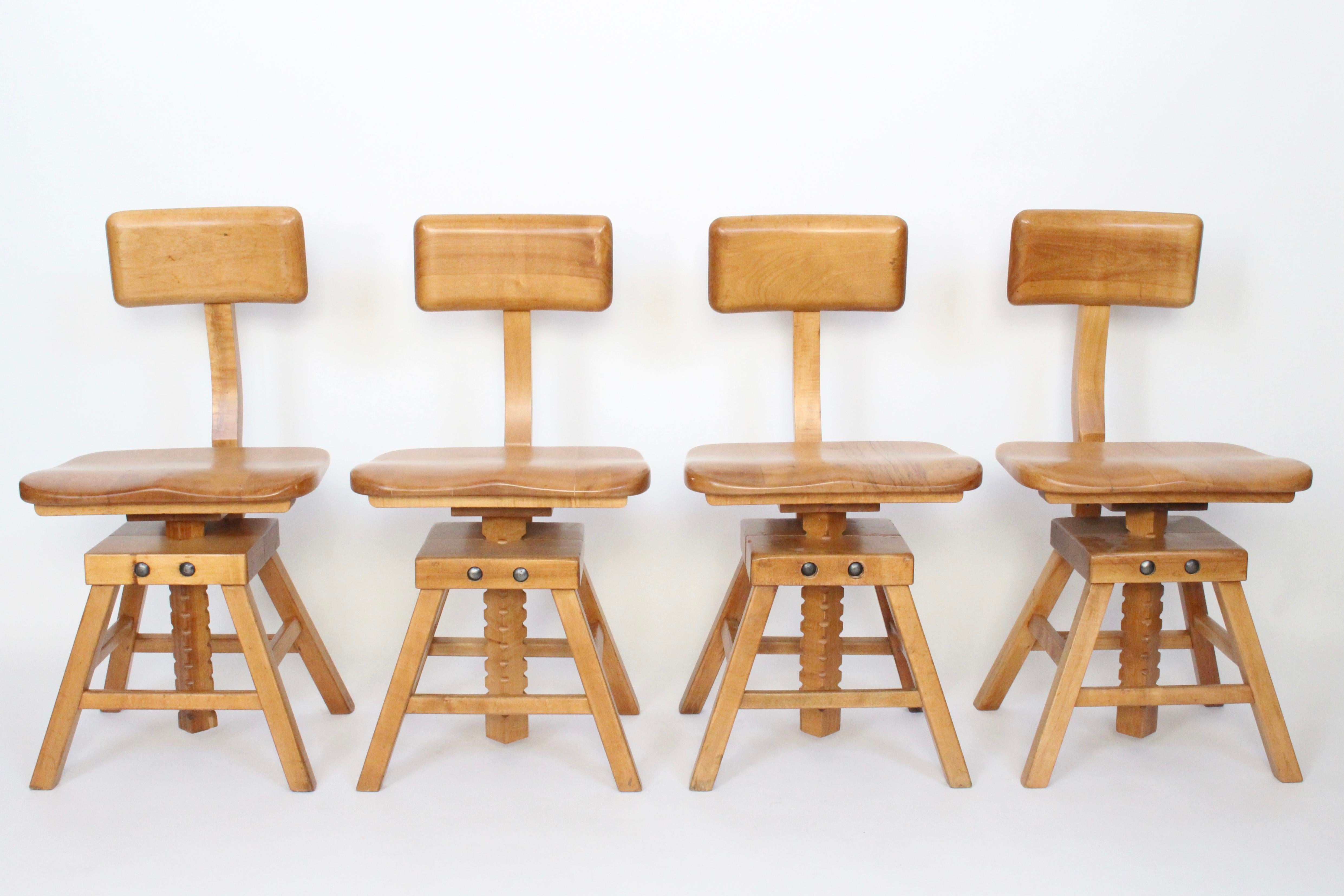 Set of 4 sit-rite solid maple drafting chairs, manufactured by the Edward L. Koenig Co. of Chicago, Illinois. This versatile, sturdy set features 3 areas, (seat, back and height), easily adjustable by wingnuts for maximum comfort. Chair seat height