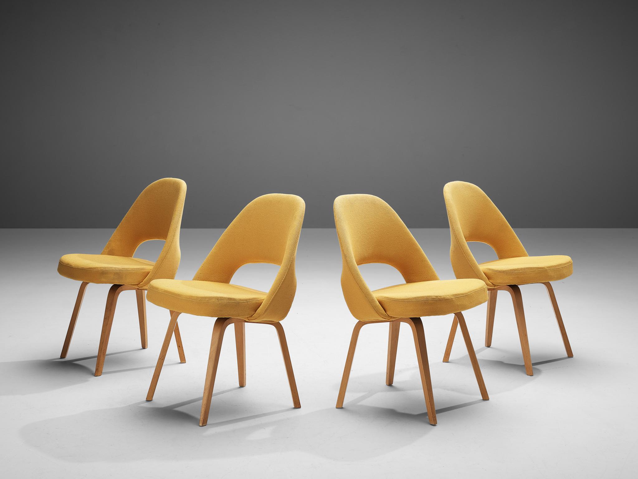 Eero Saarinen for Knoll International, set of four model 72 chairs, in wood and yellow fabric, United States 1948. 

Set of four organic shaped chairs designed by Eero Saarinen. A fluid, sculptural form. This timeless and versatile design