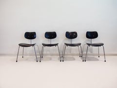 Set of Four Egon Eiermann Model SE 68 Black Lacquered Plywood and Steel Chairs