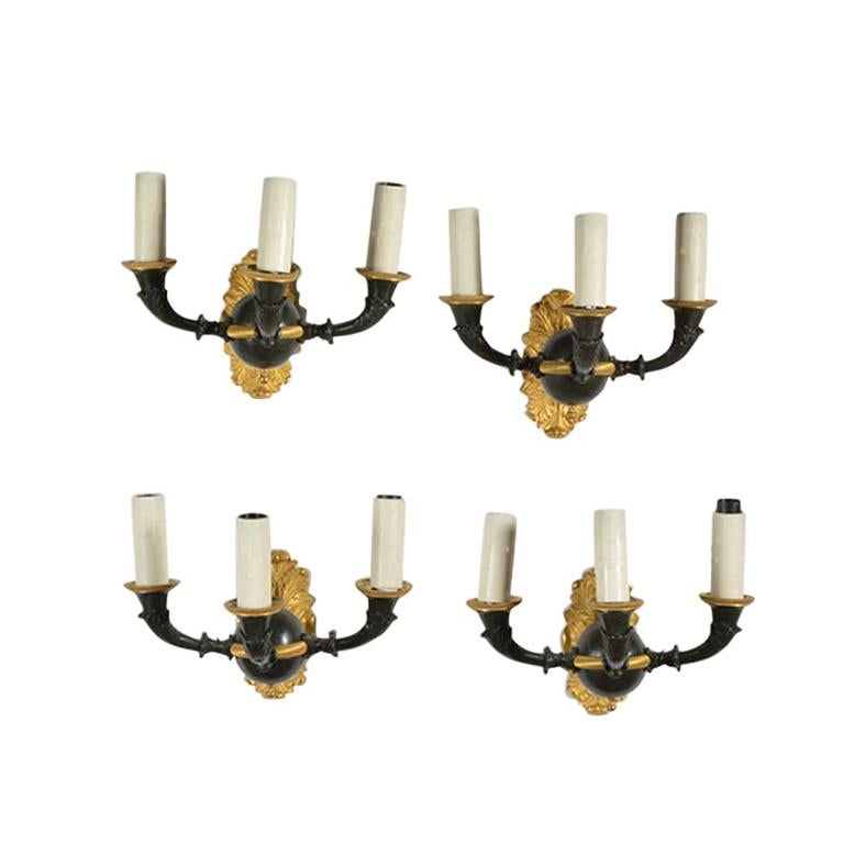 Set of Four Empire Style Three-Light Wall Sconces, Gilt and Patinated For Sale