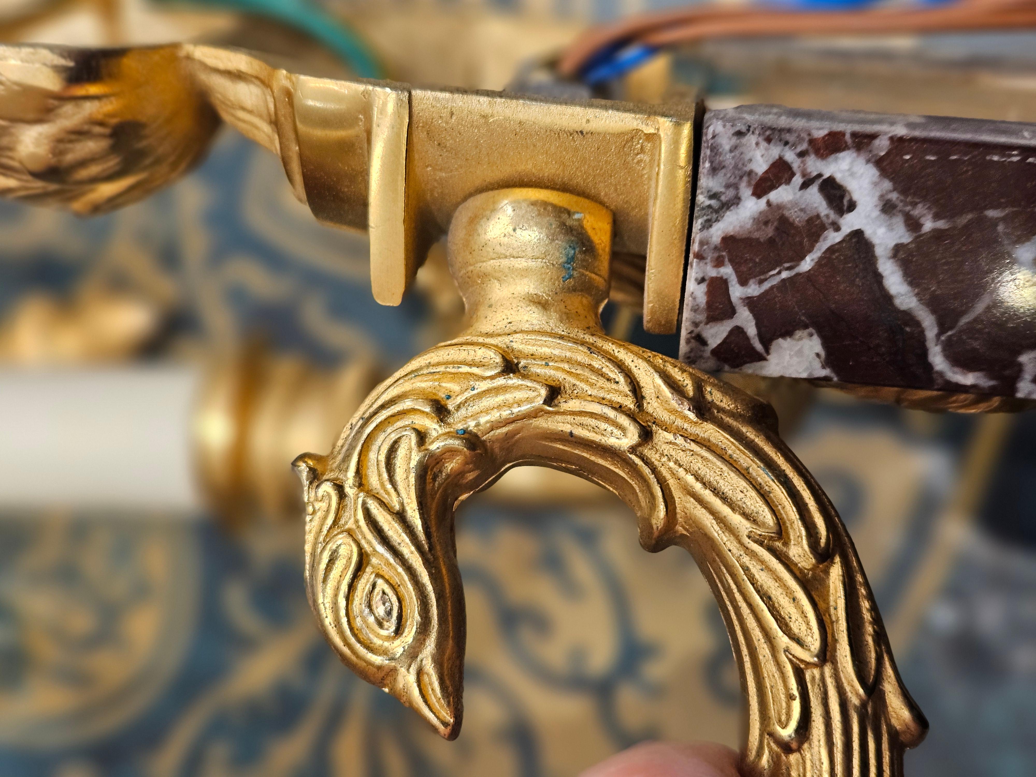 Conjunto de cuatro apliques estilo Imperio Laudarte Grifone siglo XX en venta