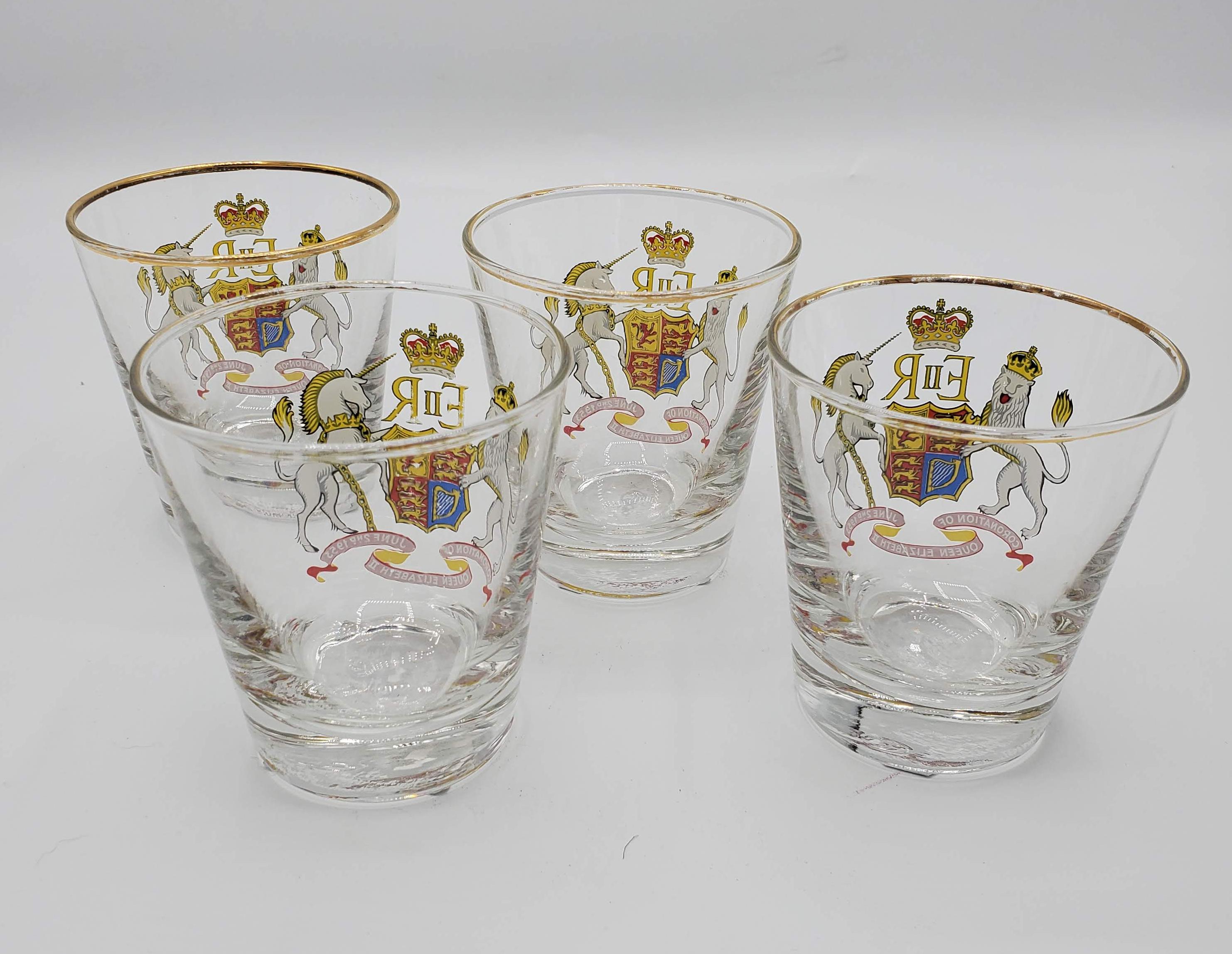 Set of Four English 1953 Queen Elizabeth II coronation souvenir drinking glasses. Excellent condition. Great for the anglophile in your life or any collector looking to add a bit of British whimsy to their life. 
Each glass measures: 3.25