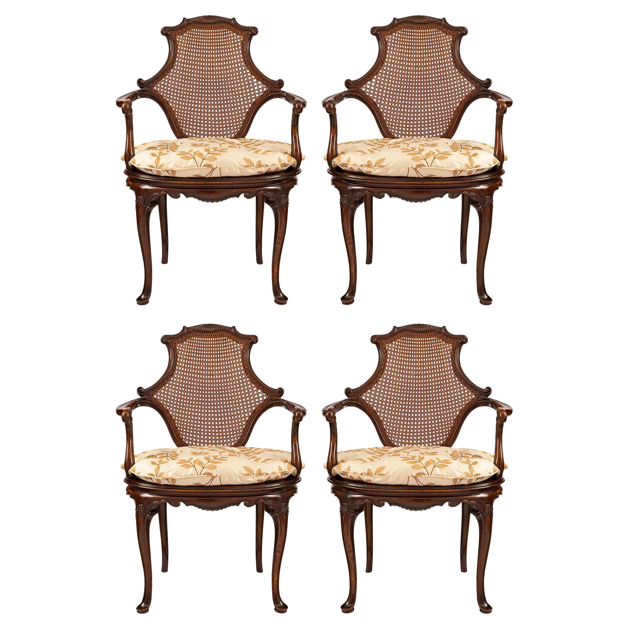 Set of Four English 19th Century Dark Oak Cane Armchairs For Sale