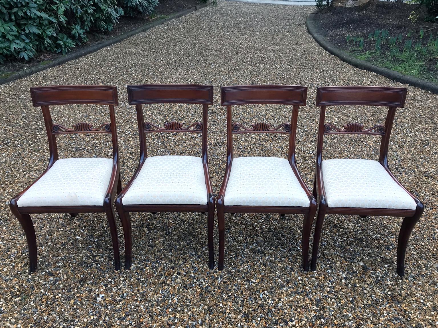 A very good quality Set of Four 19th Century Regency Mahogany Dining Chairs with newly upholstered drop-in seats on saber legs.
circa: 1835

Dimensions:
Height: 33 inches - 83.5 cms
Height to Seat: 18 inches - 46 cms
Width: 18.5 inches - 47