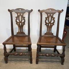 Set of Four English Bench-Made Chippendale Plank Seat Elm Chairs