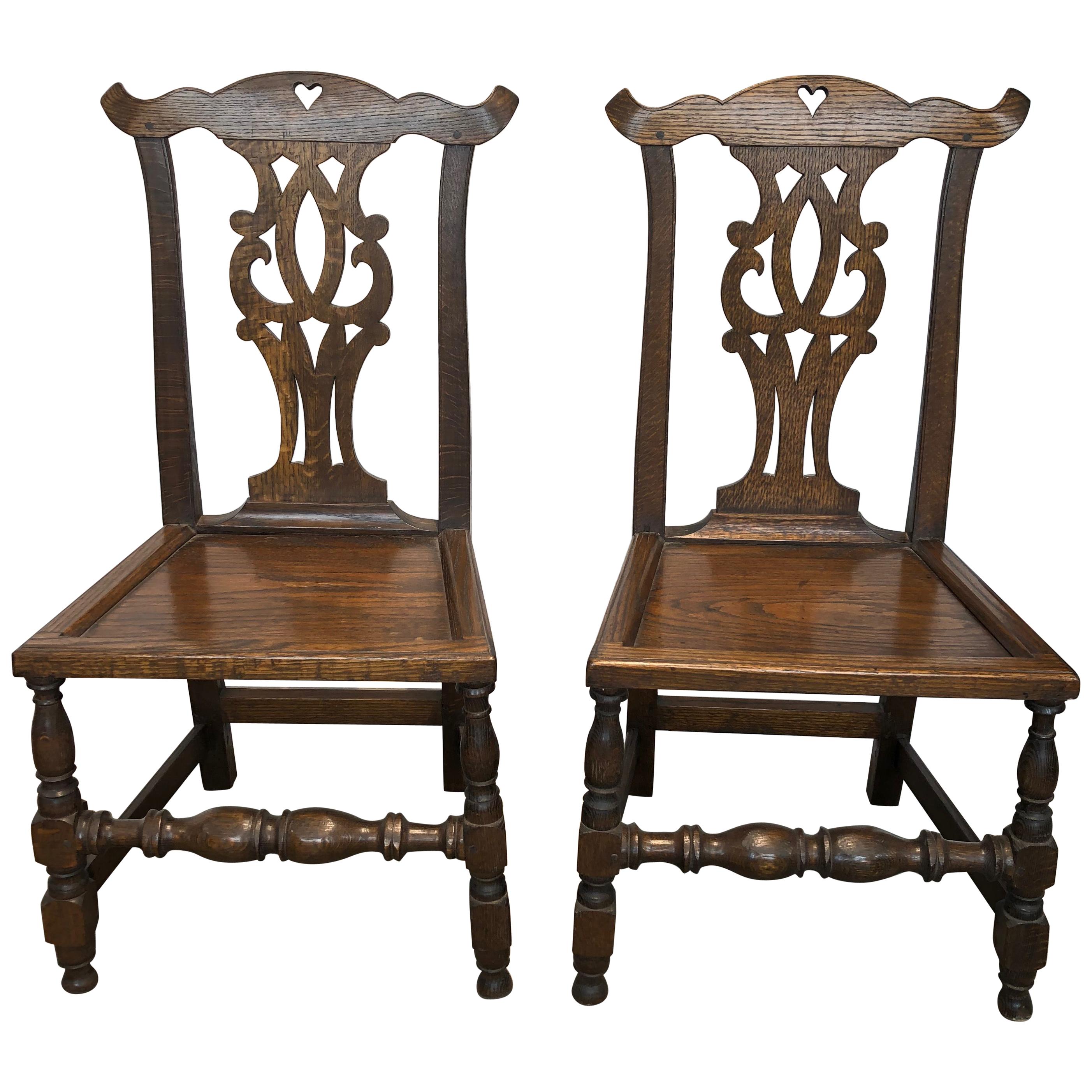 Set of Four English Bench-Made Chippendale Plank Seat Elm Chairs For Sale