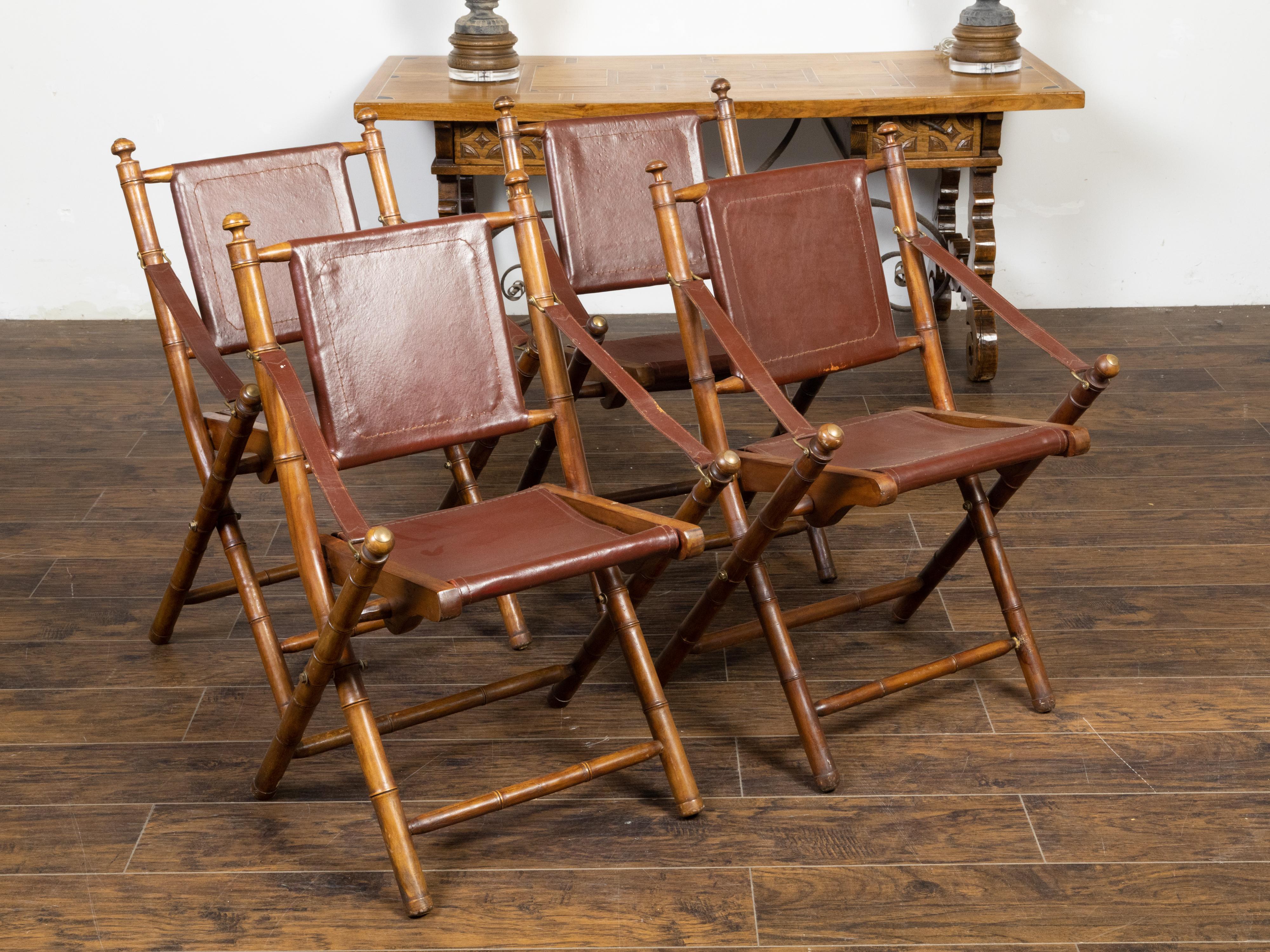 Set of Four English Campaign Faux Bamboo Folding Side Chairs with Leather Seats In Good Condition In Atlanta, GA