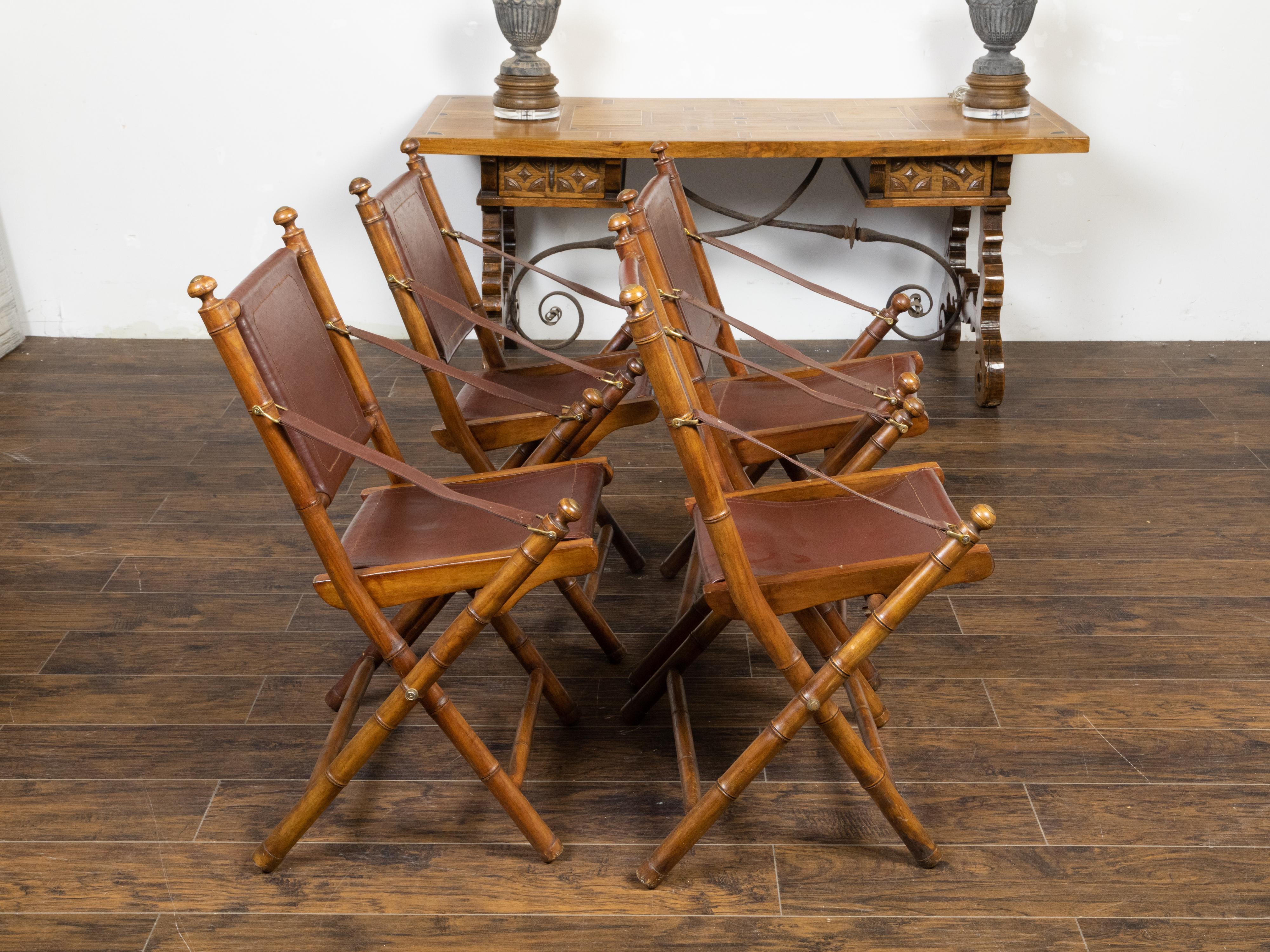 20th Century Set of Four English Campaign Faux Bamboo Folding Side Chairs with Leather Seats