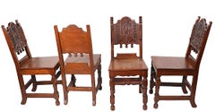 Set of Four English Carved Oak Cafe Dining Chairs in the Jacobean Style c 1920's