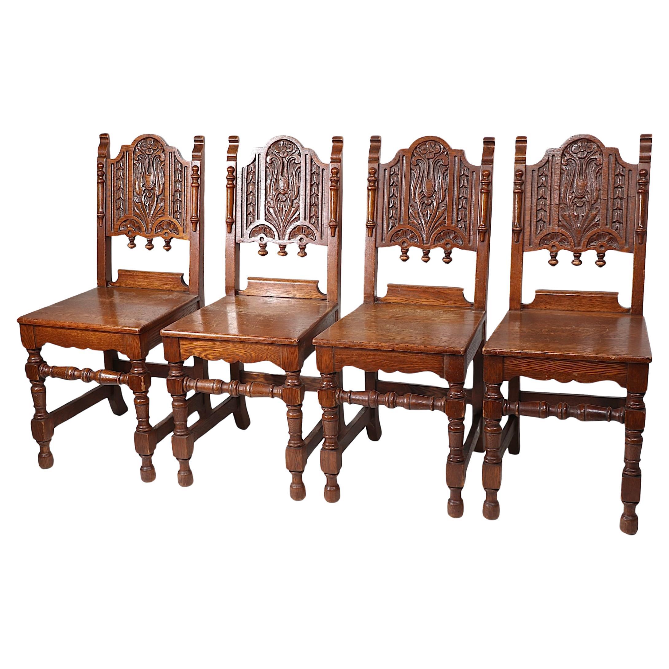 Set of Four English Carved Oak Cafe Dining Chairs in the Jacobean Style c 1920's For Sale