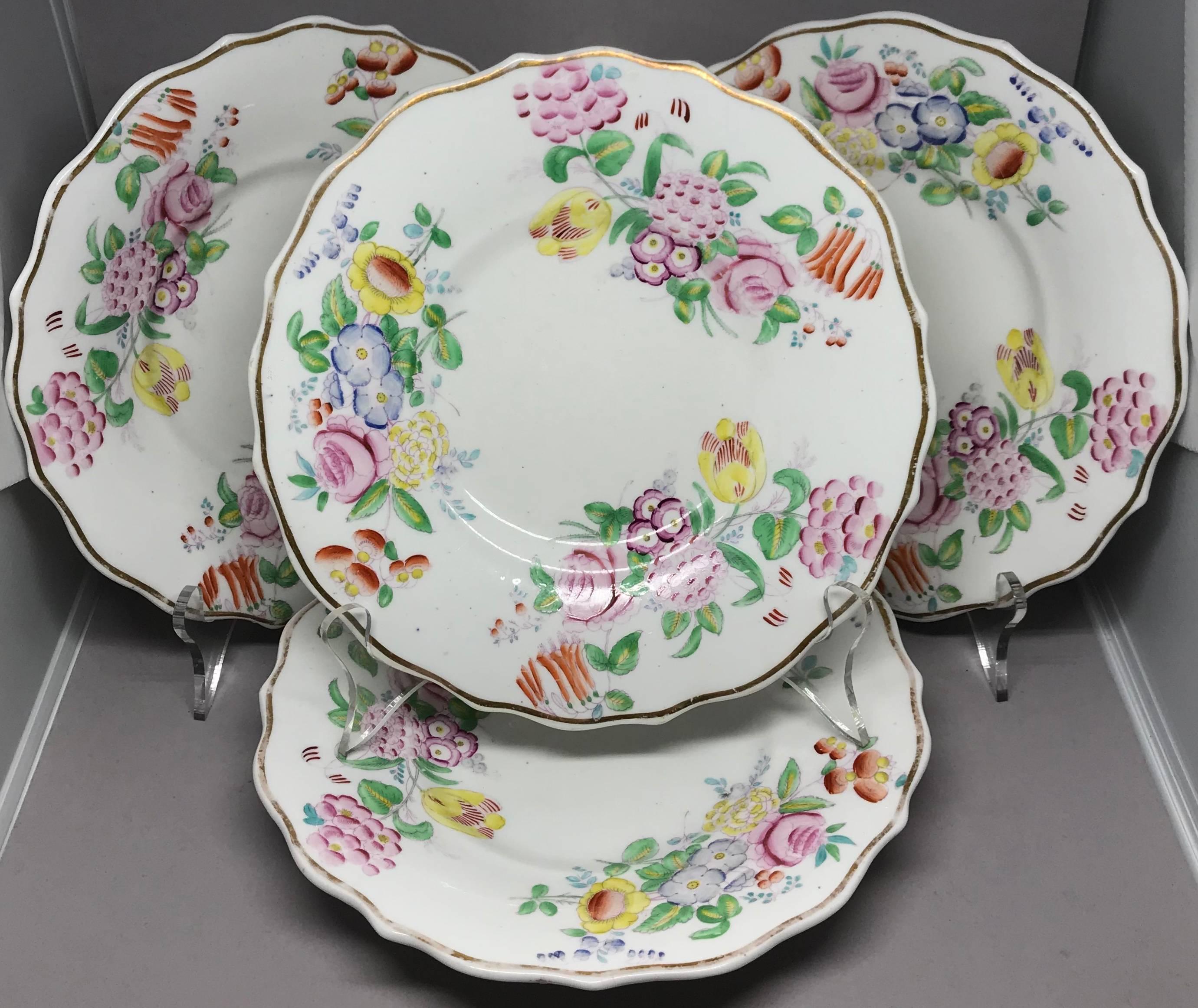 Set of four English gilt-edged floral plates.  Set of four luncheon/dessert plates with gilt scalloped rims and hand-painted floral sprays. Beautiful Easter / hostess gift.  England, circa 1840s. 
Dimension: 8.75