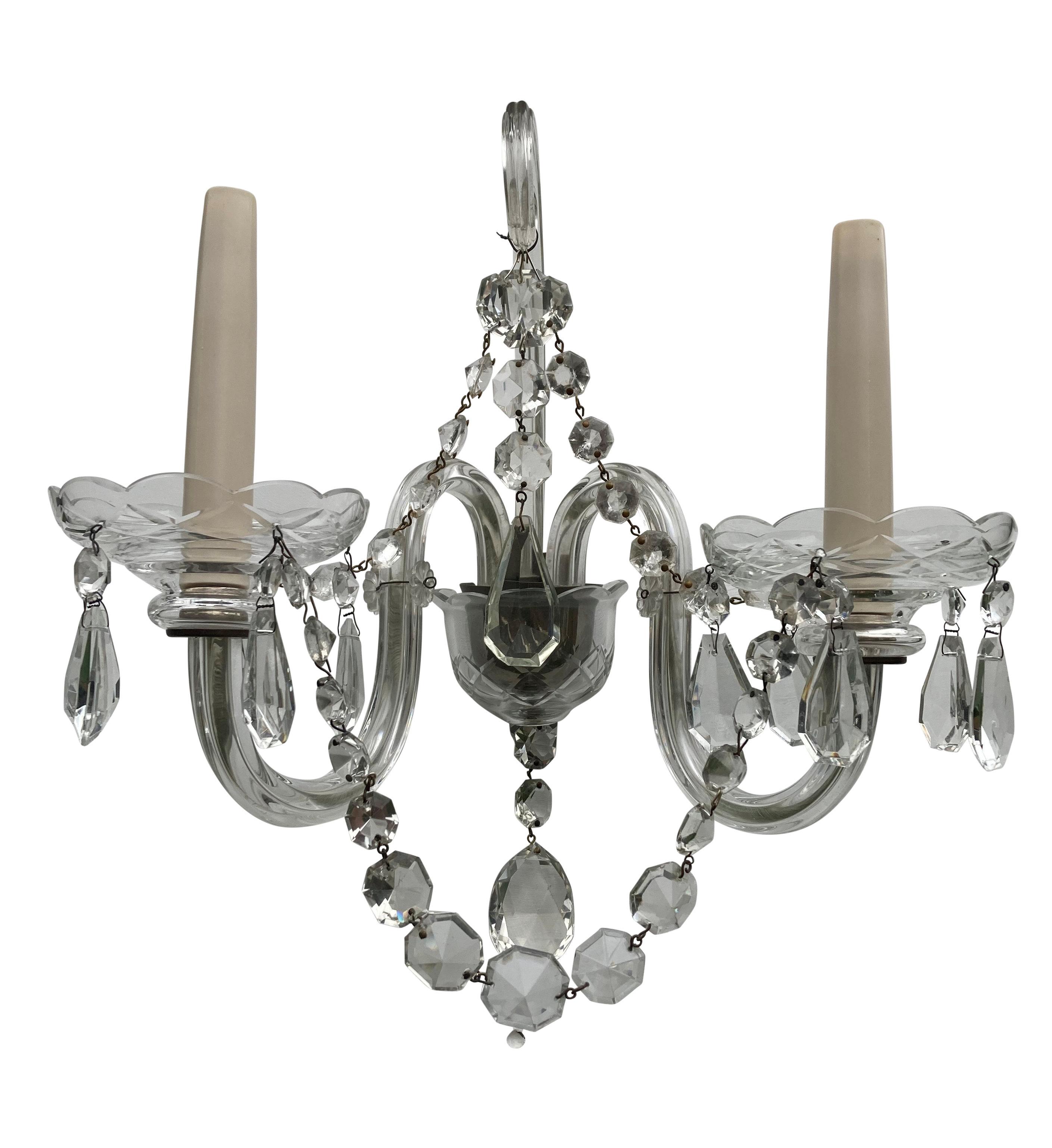 A set of four English glass twin branch wall lights in the XIX Century manner. With central scroll, swags and pendants.