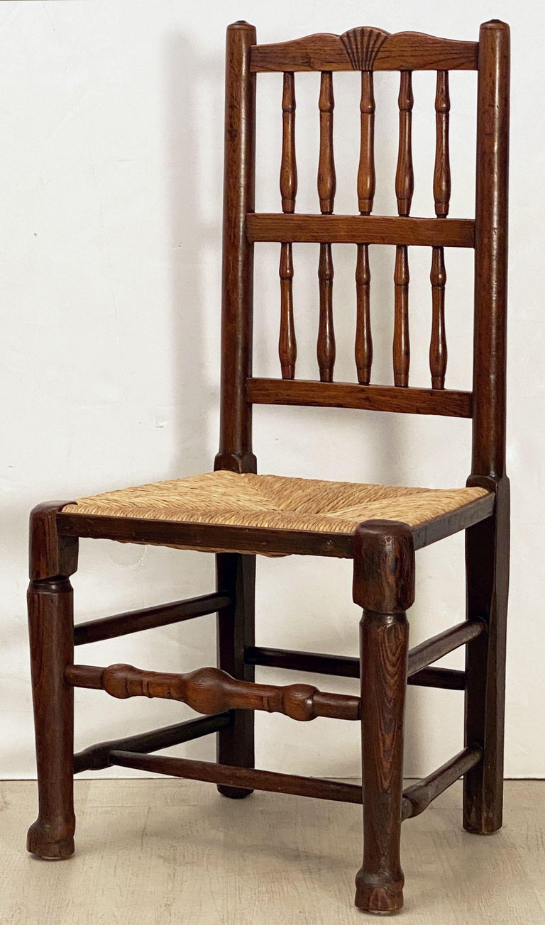 Set of Four English Oak Spindle Back Chairs with Rush Seats at 1stDibs